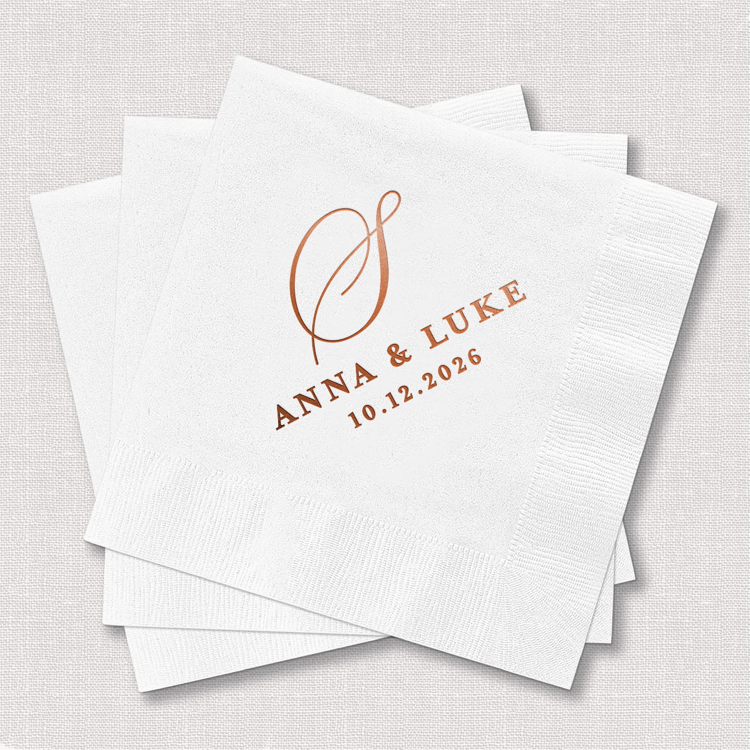 A product photo of a personalized cocktail napkin from the Classic Monogram Wedding Bundle, featuring a traditional monogram design on soft 3-ply paper stock.