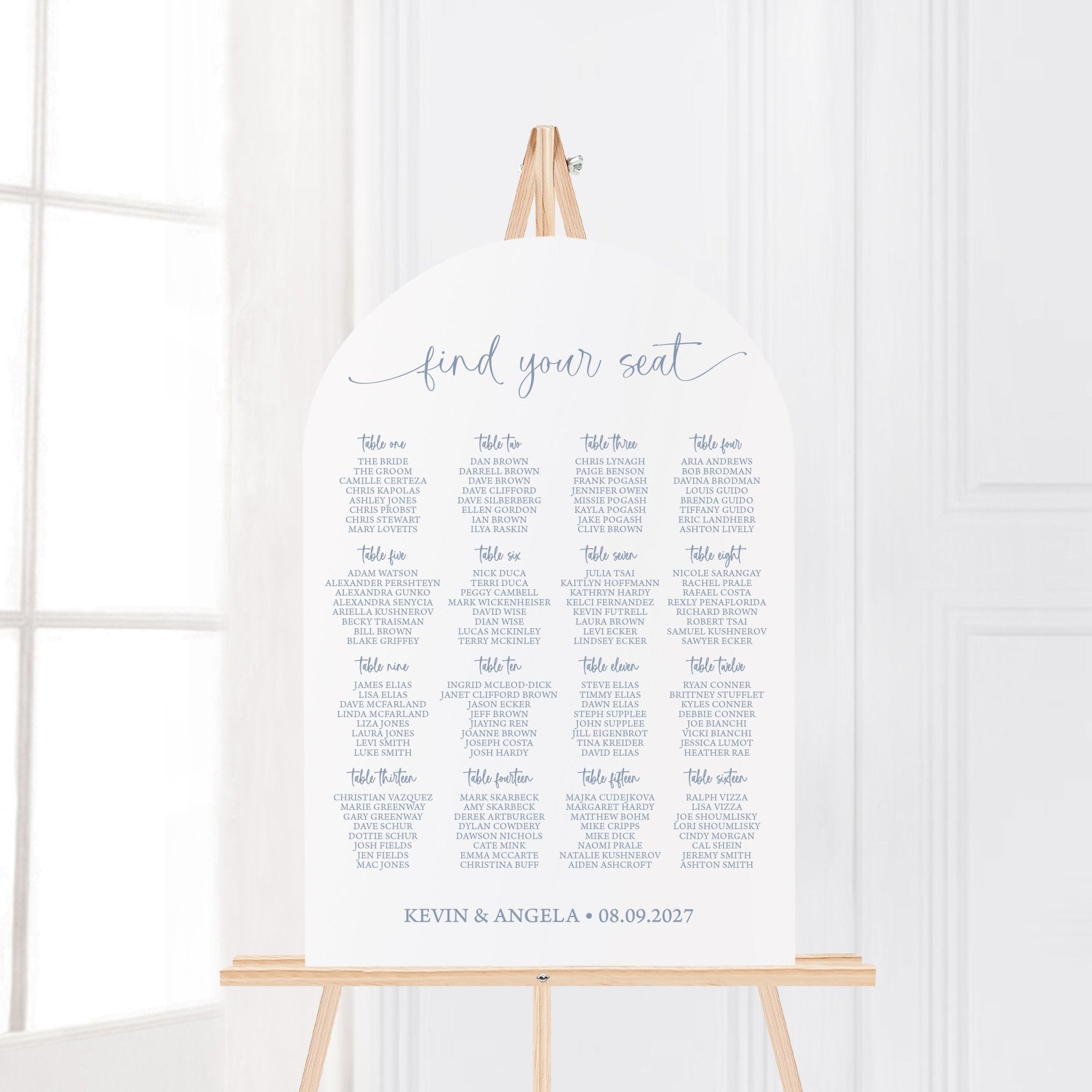 Arched acrylic wedding seating chart listing tables and guests