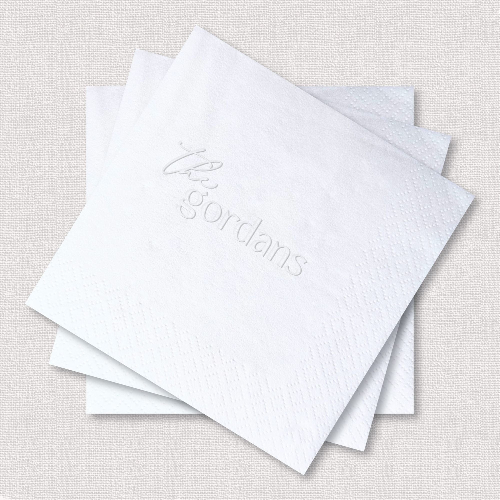 Custom Embossed Napkins Script and Sans Serif Surname White Square Stack Close Up – Rubi and Lib