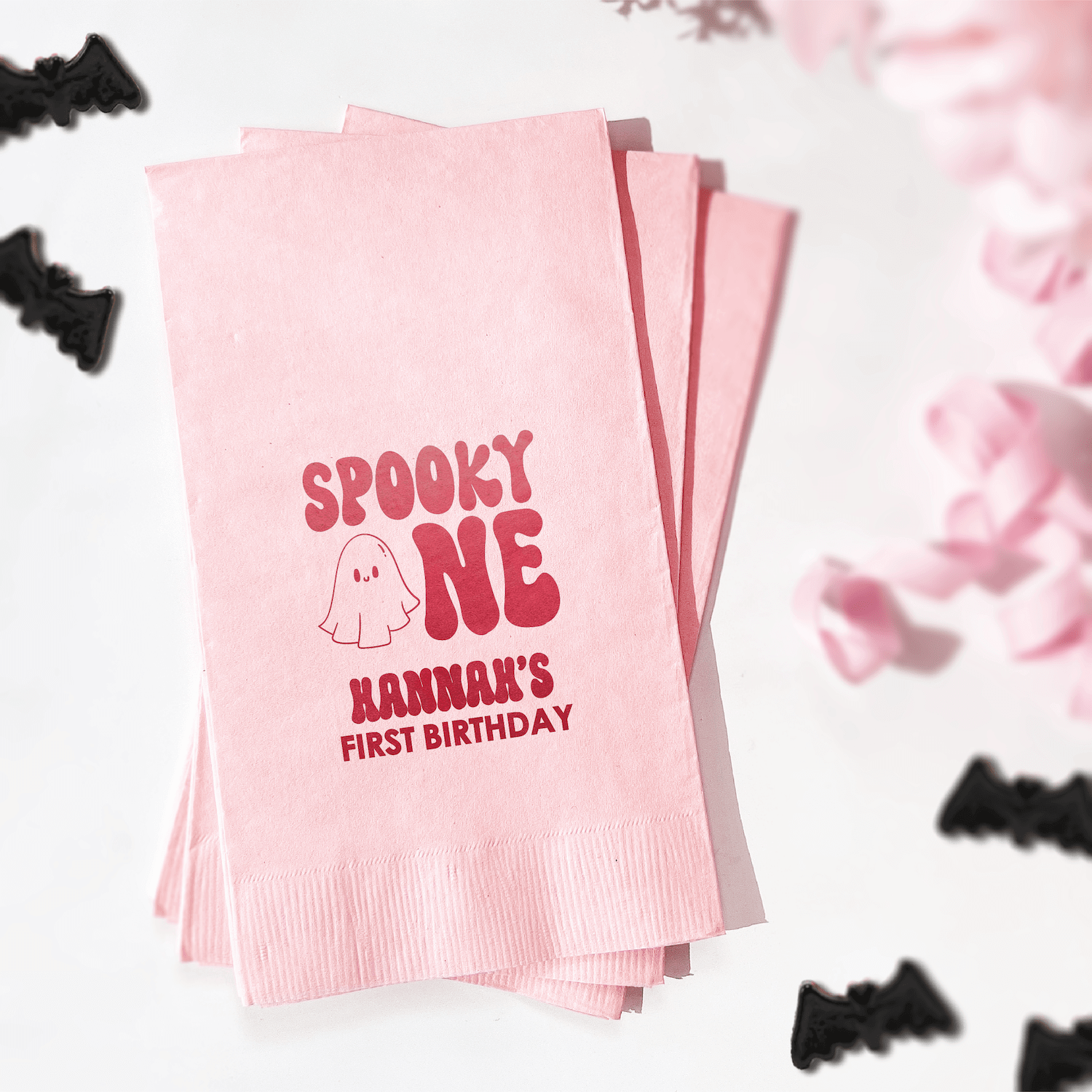 Pink napkins with "Spooky One" ghost design and "Hannah's First Birthday" personalization in red foil stamping