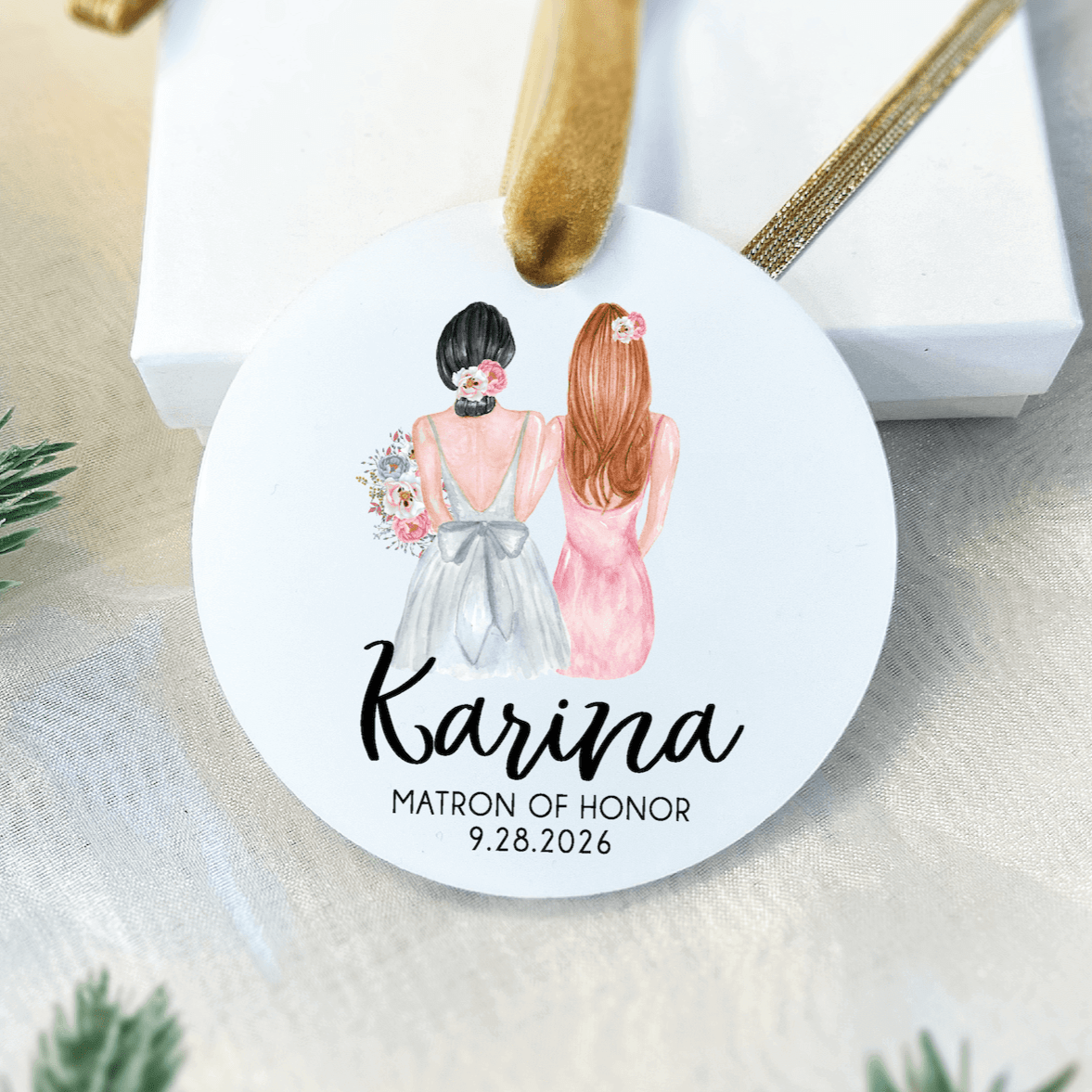 White acrylic ornament with illustrated bridesmaids, personalized with name "Karina" and "Matron of Honor 9.28.2026" text