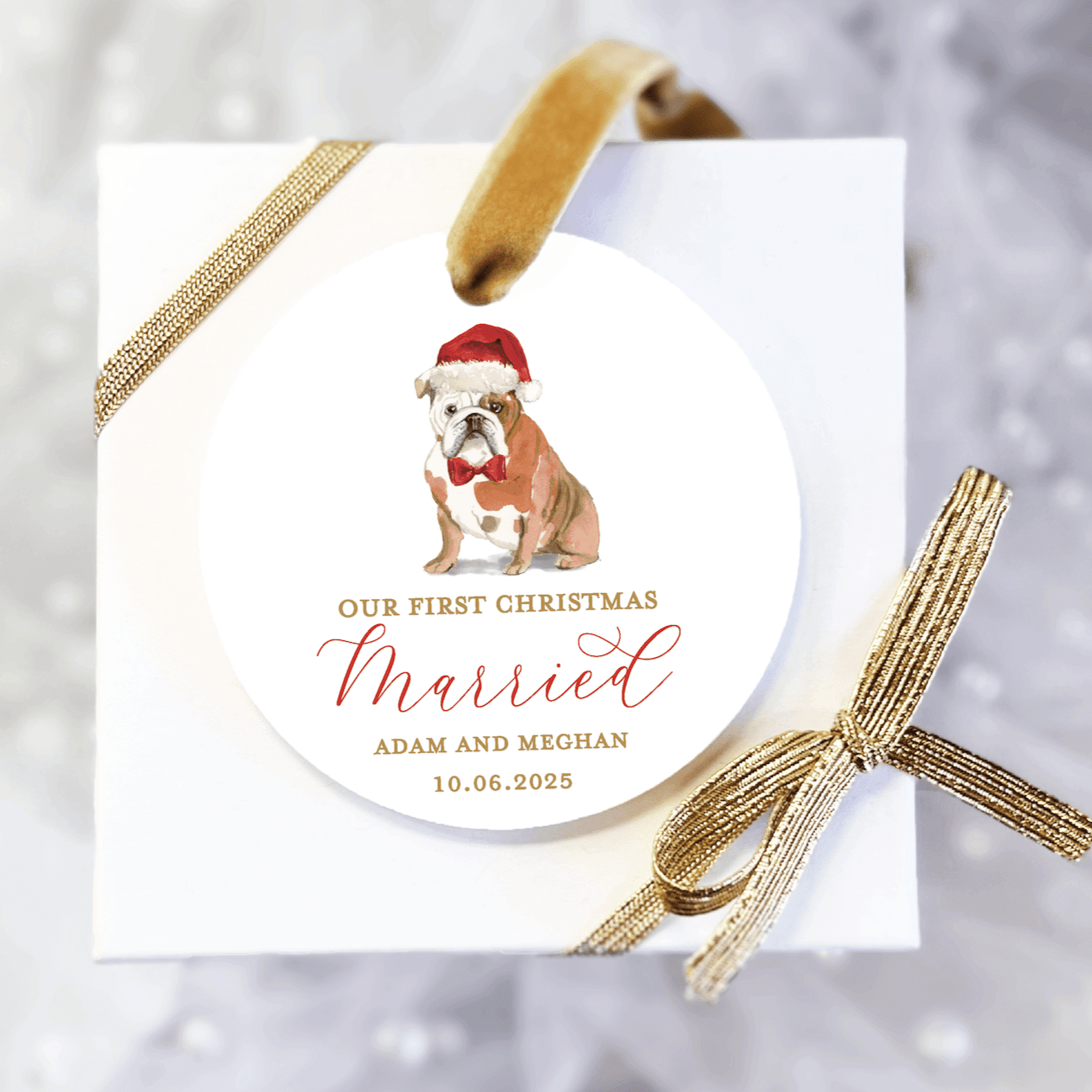 White acrylic ornament with bulldog wearing Santa hat, "Our First Christmas Married" text, and personalized names and date in red script.