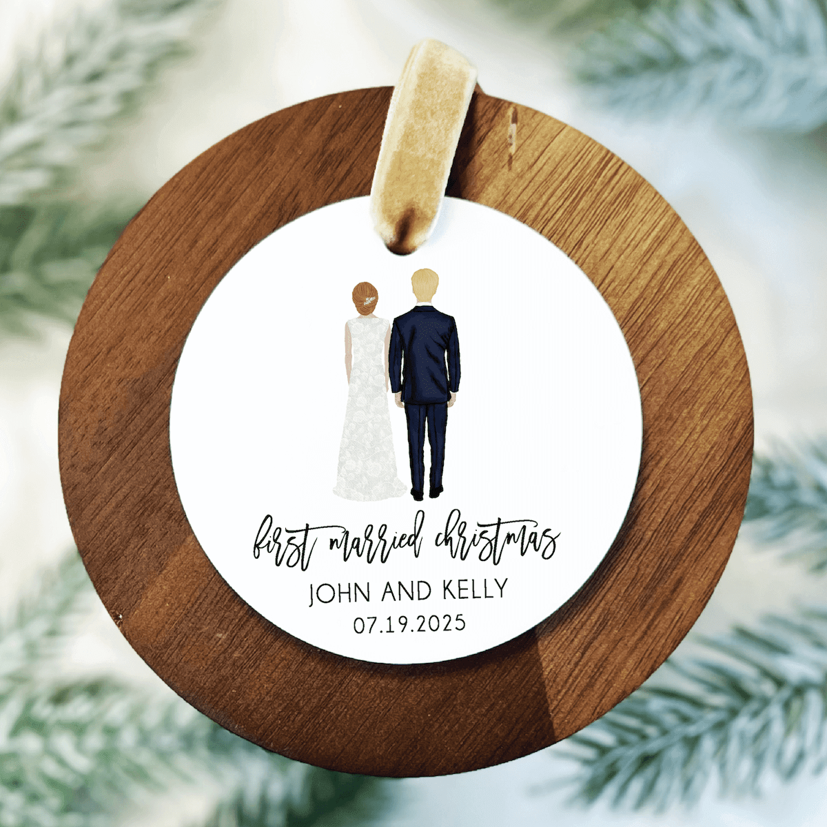 Wooden round ornament with bride and groom illustration, personalized "First Married Christmas" text and couple names with date.