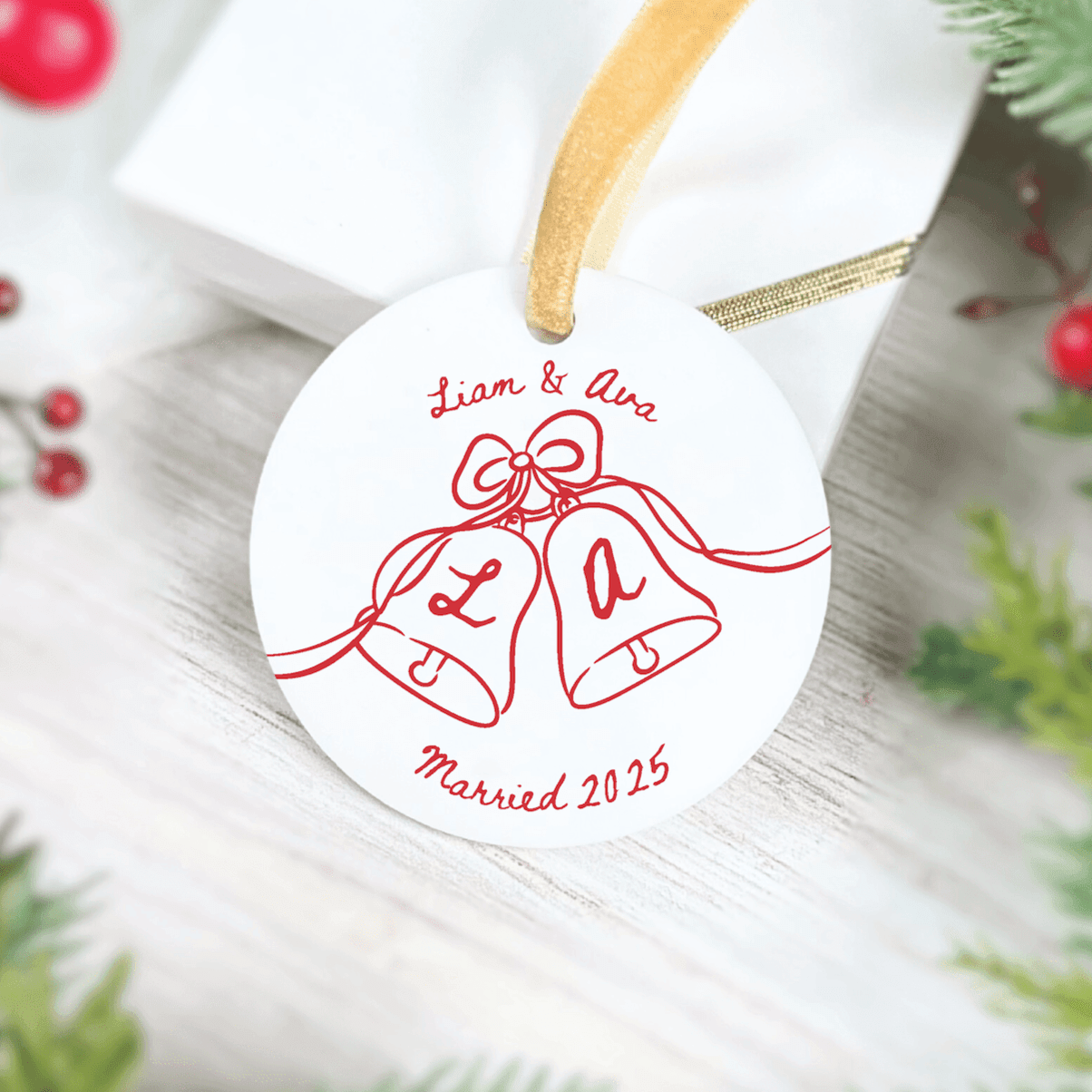 White acrylic ornament with red bell design, personalized with names and "Married 2025" text, wooden string hanger