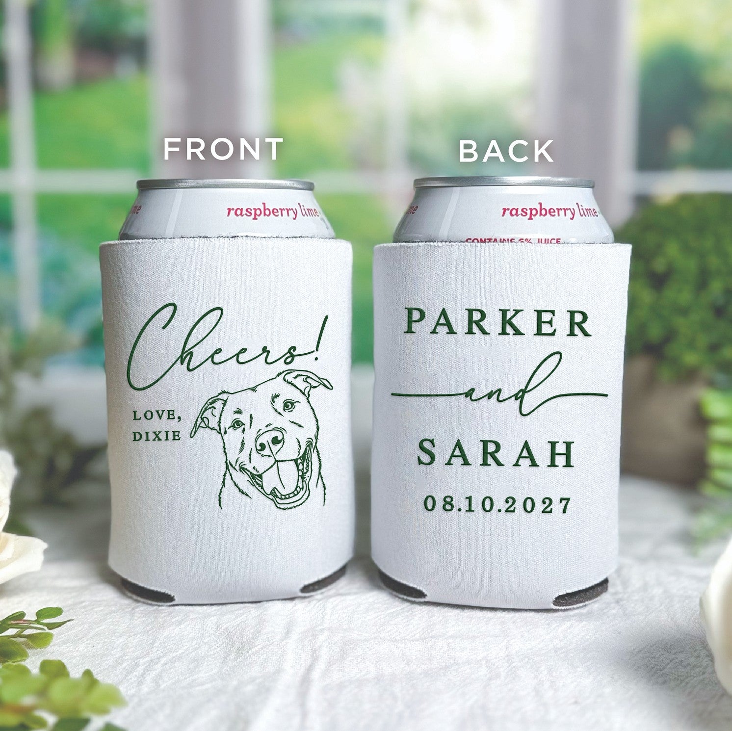 Two white neoprene can coolers feature personalized green illustrations and text, designed to keep drinks cold for a wedding celebration.