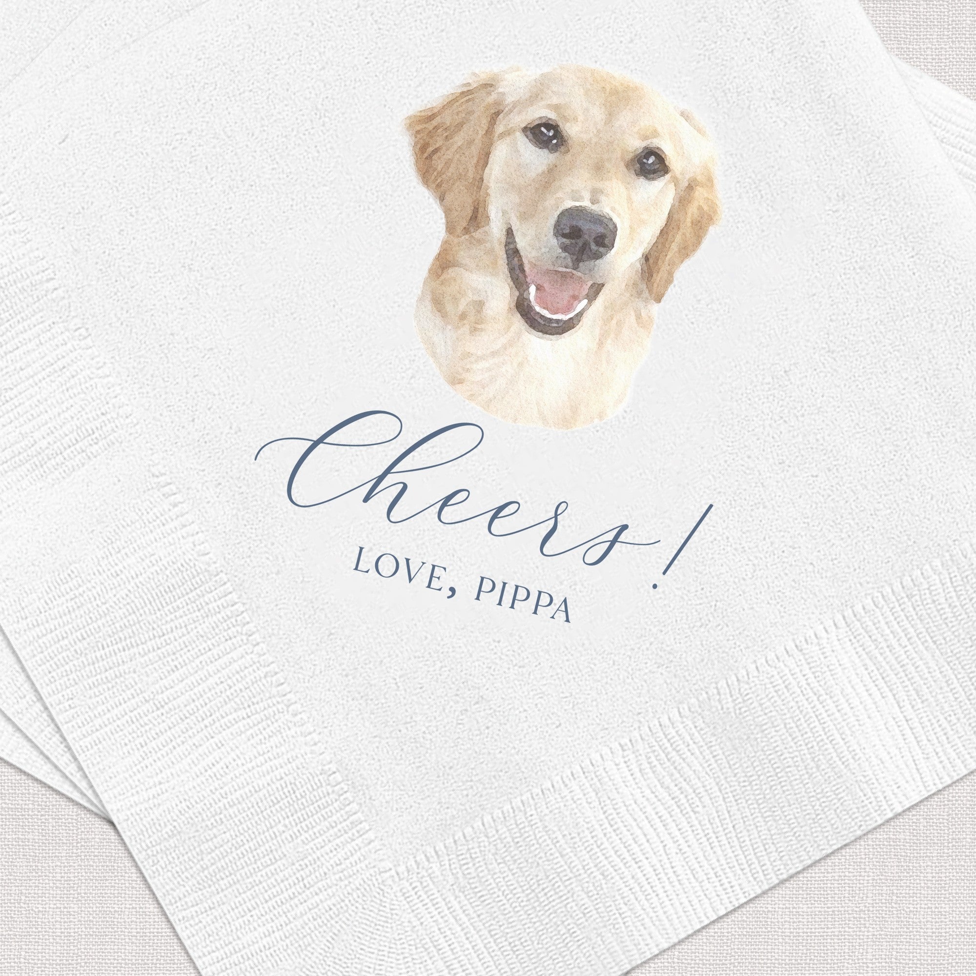 A stack of white personalized cocktail napkins, featuring a watercolor illustration of a golden retriever dog and elegant dark blue script typography, perfect for a wedding or special event.