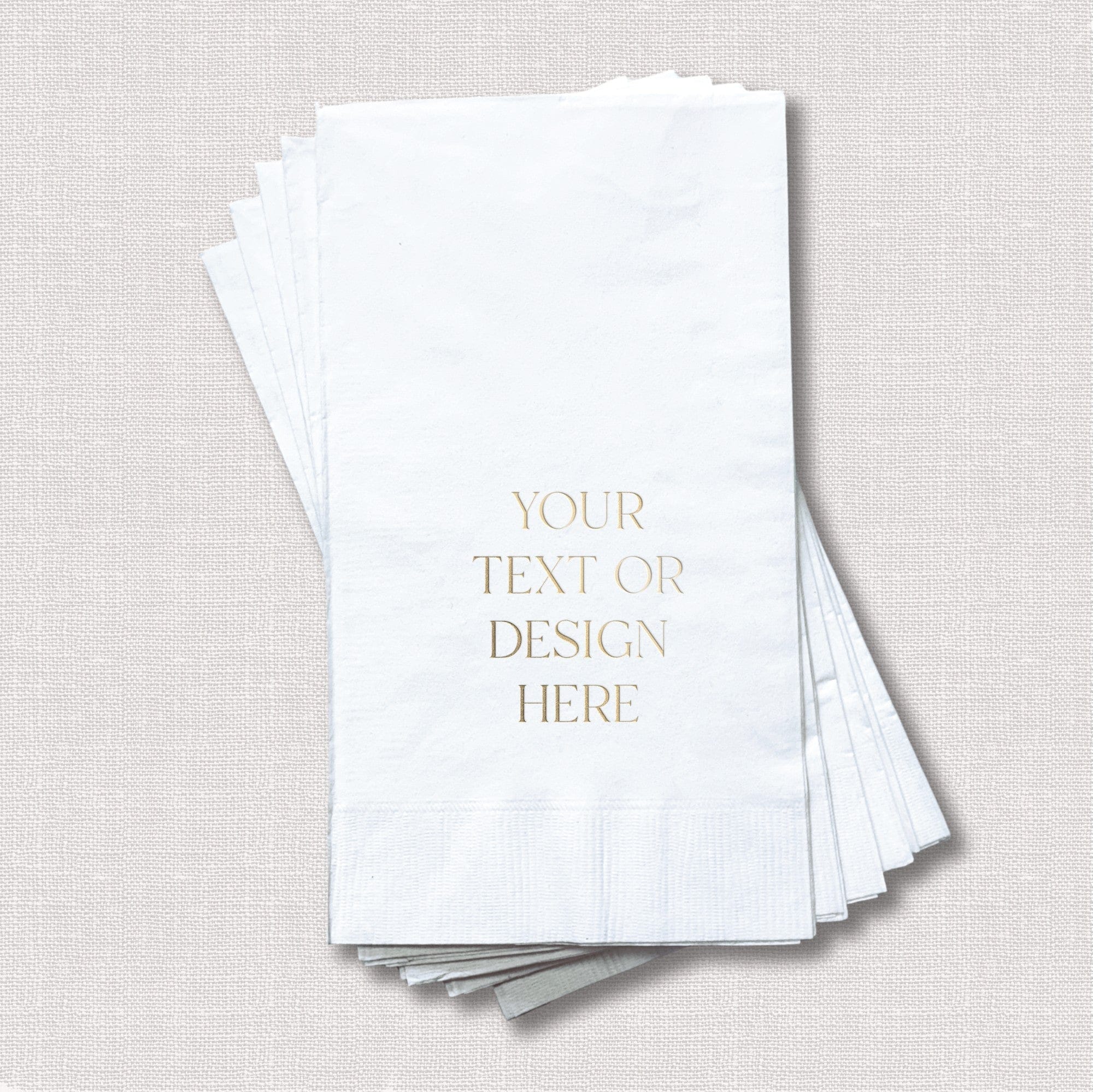 A stack of white paper guest towels or napkins designed for personalized event decor.