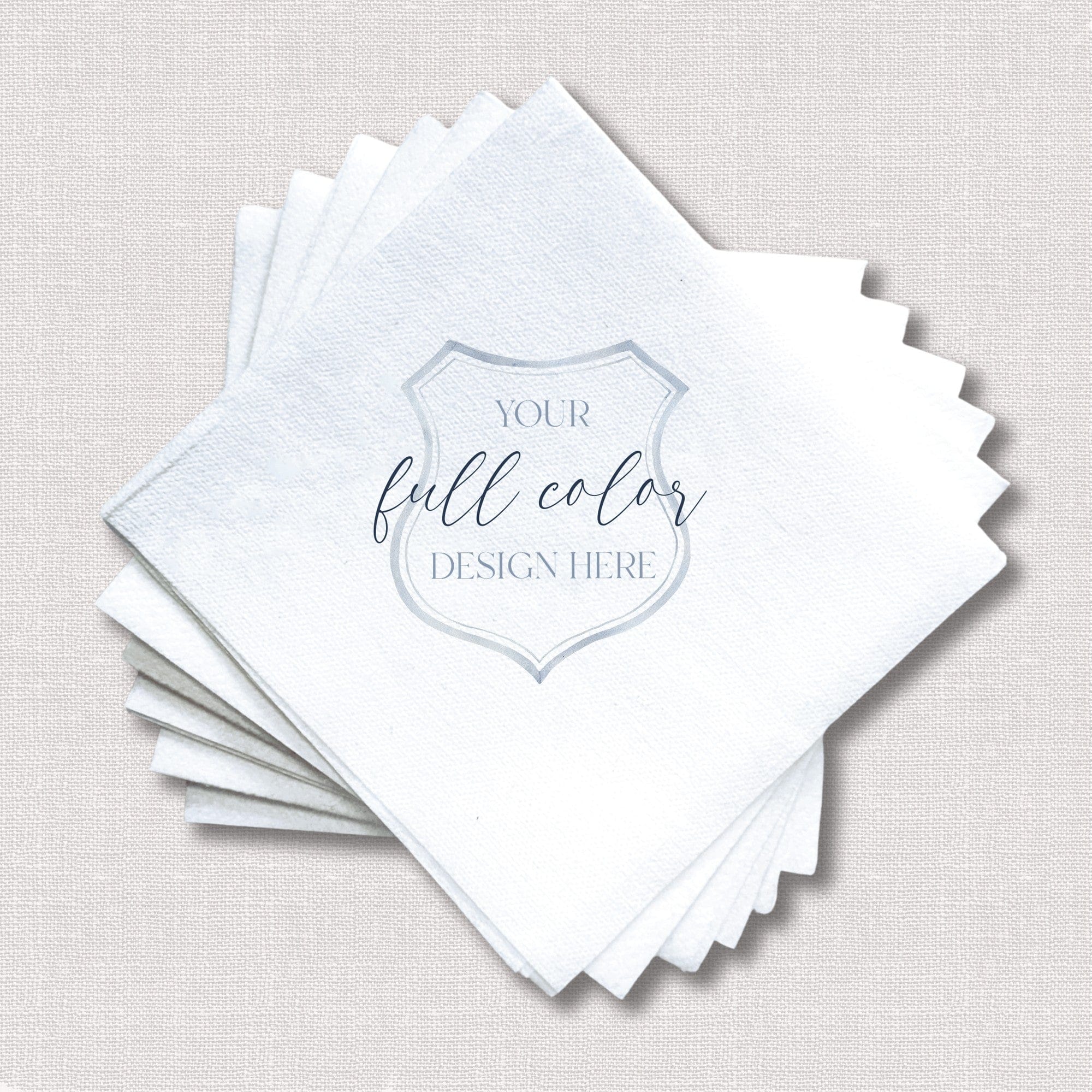 A stack of white textured paper napkins, designed for event decor, featuring a customizable full-color design area for personalization.