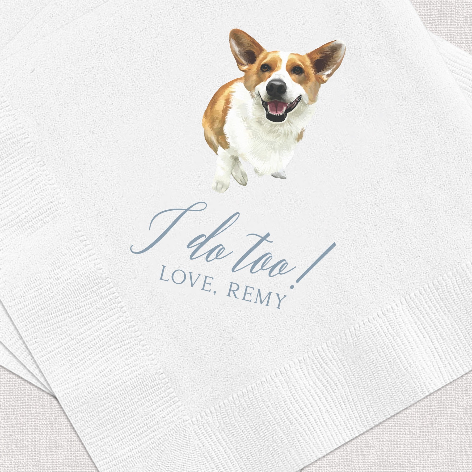 White textured paper napkins featuring a joyful illustration of a brown and white Corgi dog, ideal for personalized wedding or event decor.
