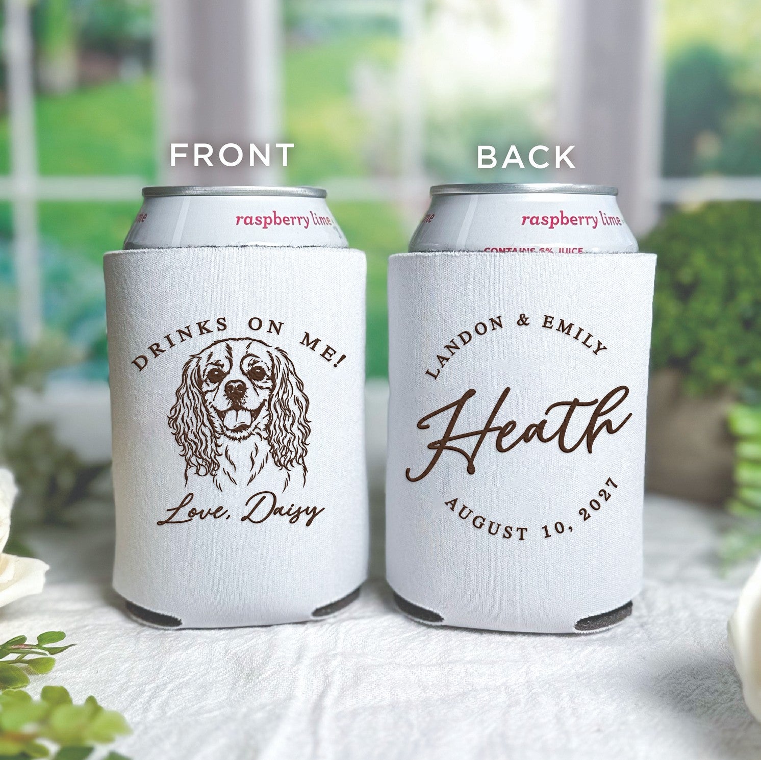 Two white fabric can coolers, customized with a brown design featuring a pet illustration on one and a family name style on the other, designed as personalized event favors.
