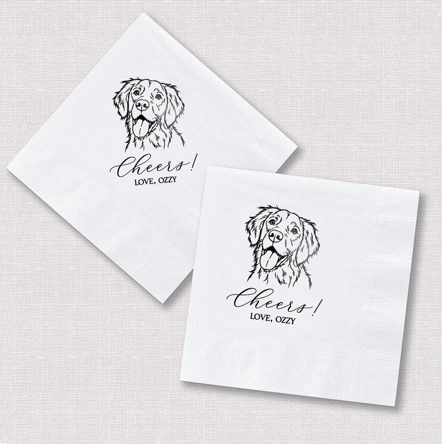 Two white folded paper cocktail napkins feature a custom black line art dog portrait and a personalized celebratory phrase, ideal for a wedding or special event.