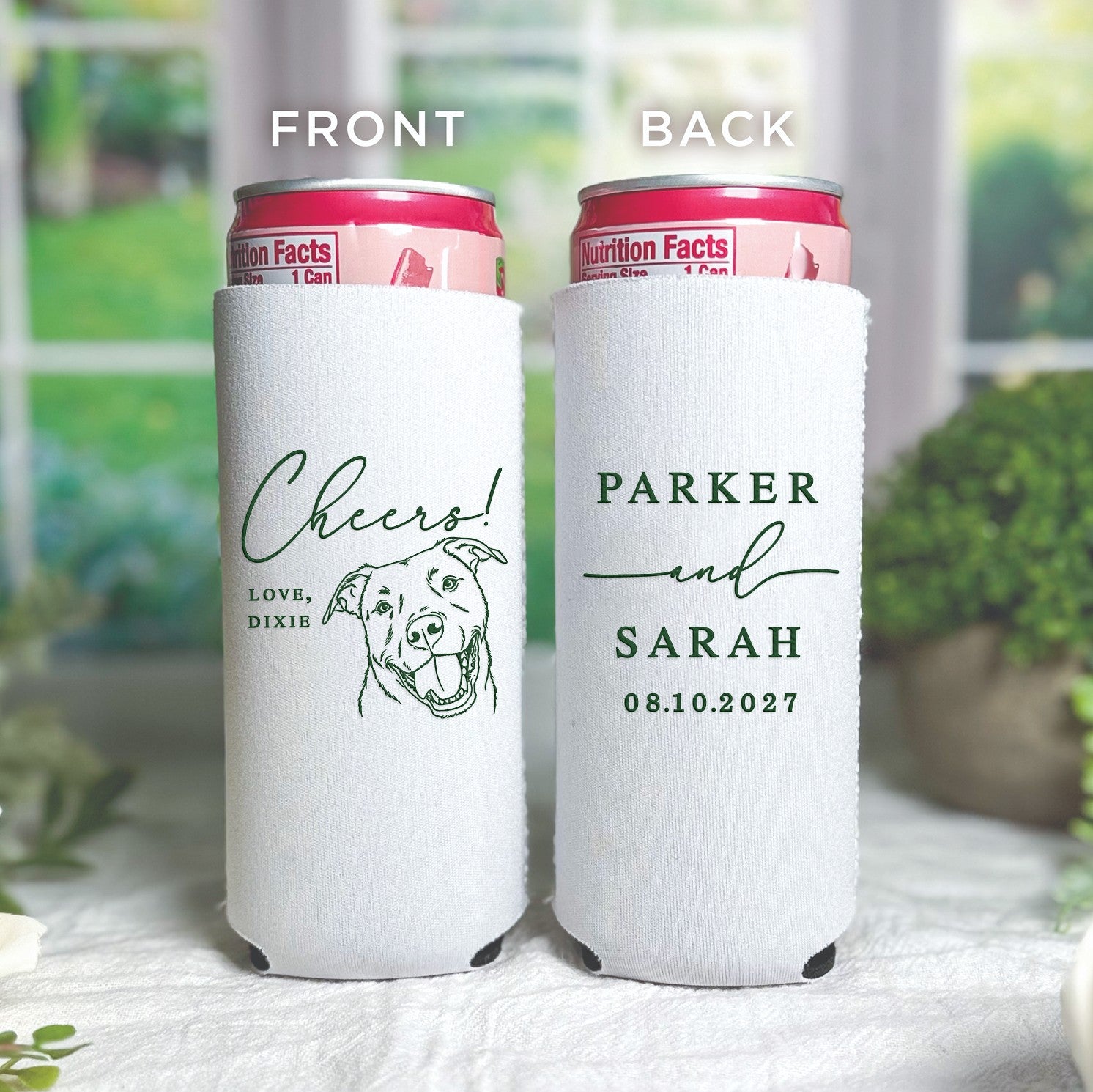 A pair of white fabric slim can coolers, one featuring a green dog illustration, and the other with a two-line custom text design, ideal for personalized wedding or event favors.