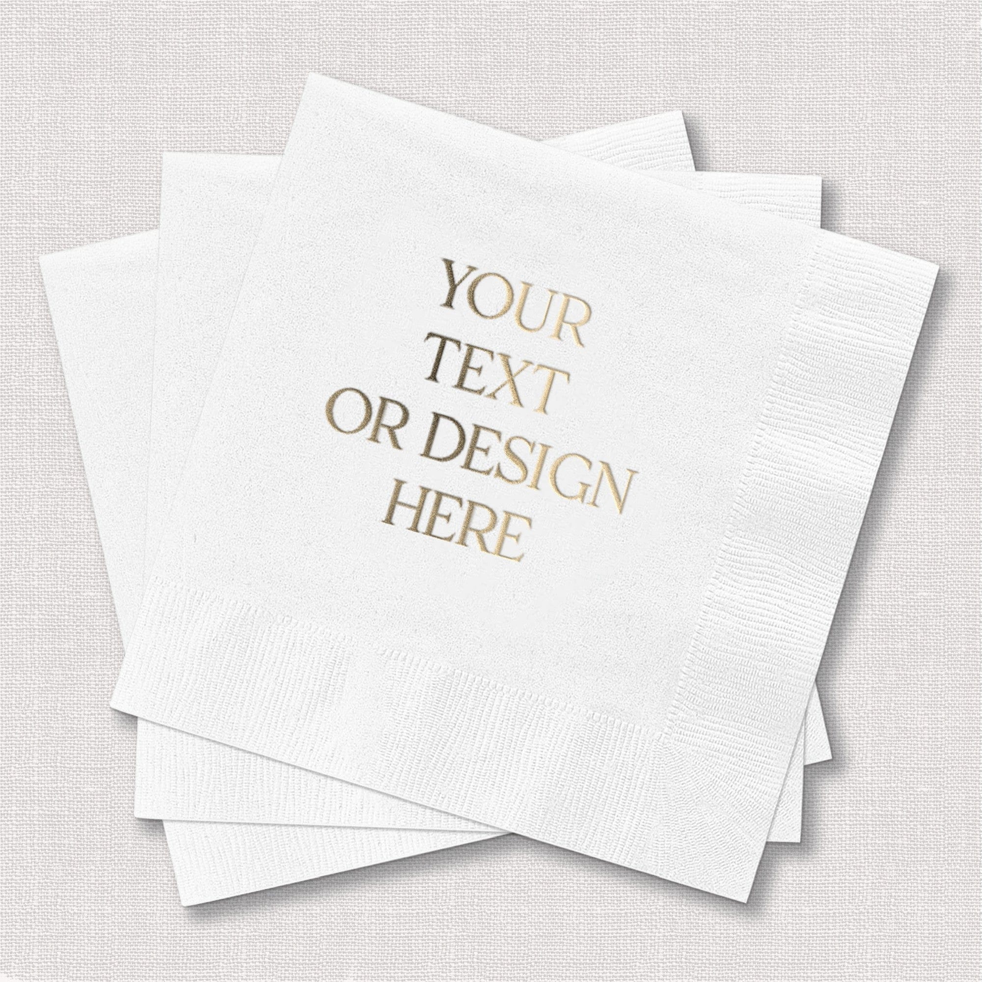 A stack of white, textured paper cocktail napkins, designed for custom metallic foil printing, suitable for wedding receptions or special events.
