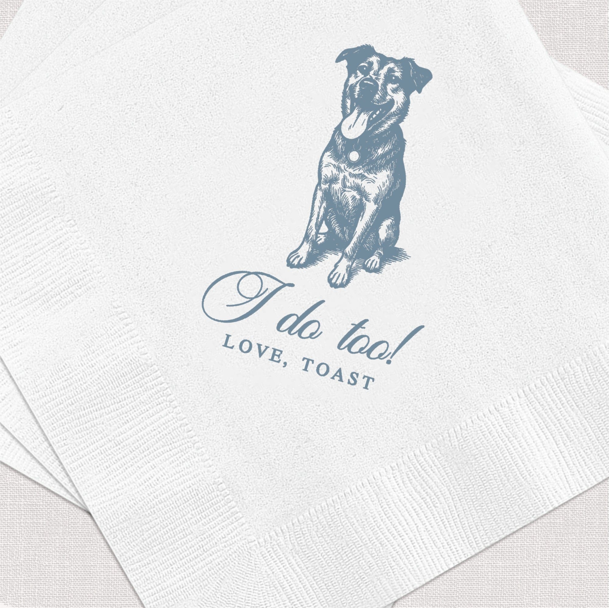 Stack of white textured paper napkins featuring a blue-grey illustration of a happy dog, designed for personalized wedding or event decor.
