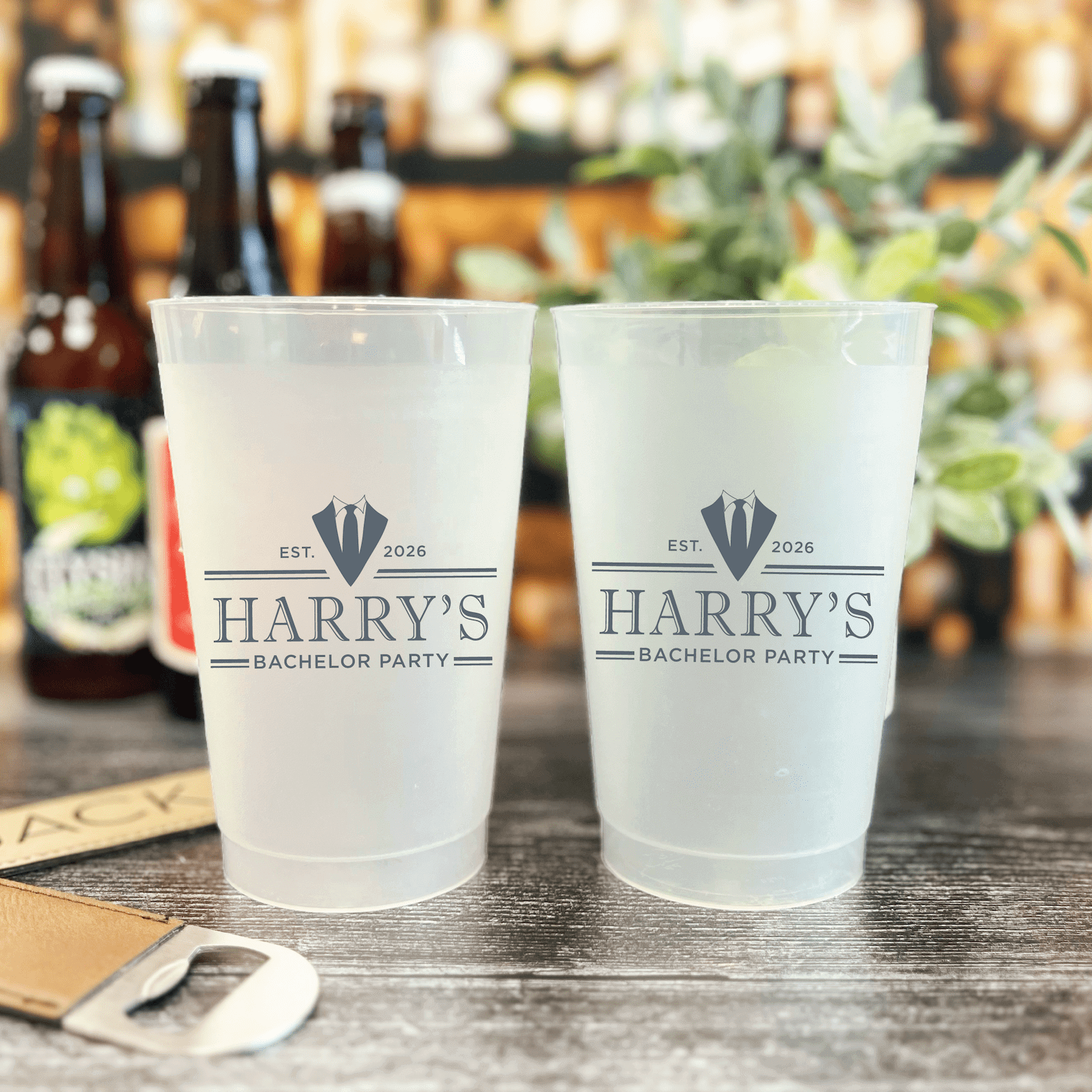 Frosted plastic cups with Harry's Bachelor Party design featuring diamond icon and established date text