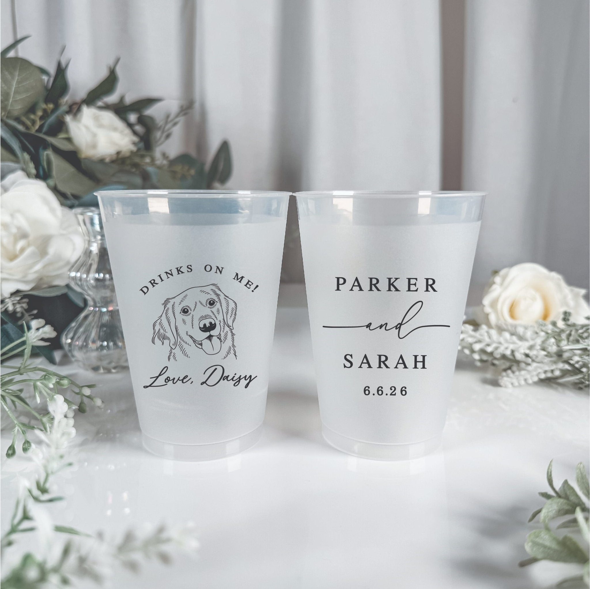 Two frosted plastic cups with personalized wedding designs: one featuring a dog illustration and "Love, Derry," the other with "PARKER & SARAH 6.6.24"