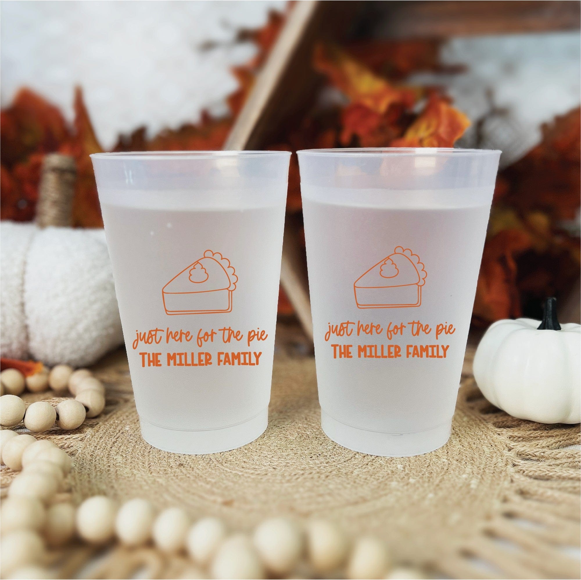 Two frosted translucent plastic cups featuring a personalized orange pie graphic with whipped cream and celebratory text, perfect for a fall or Thanksgiving event.
