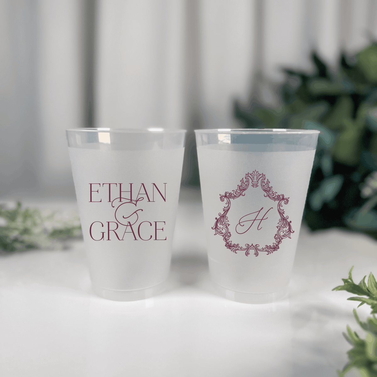 Mauve ink frosted shatterproof wedding cups with Ethan & Grace names and ornate crest H monogram