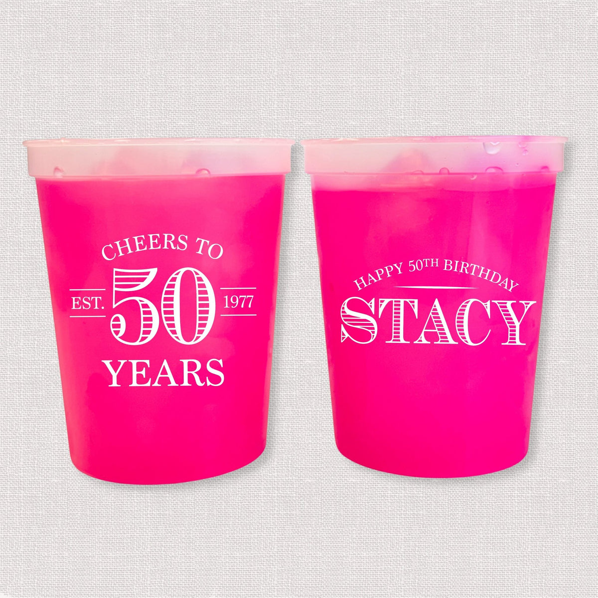 Magenta color changing birthday stadium cups with vintage Cheers to 50 Years design and Happy 50th Birthday name