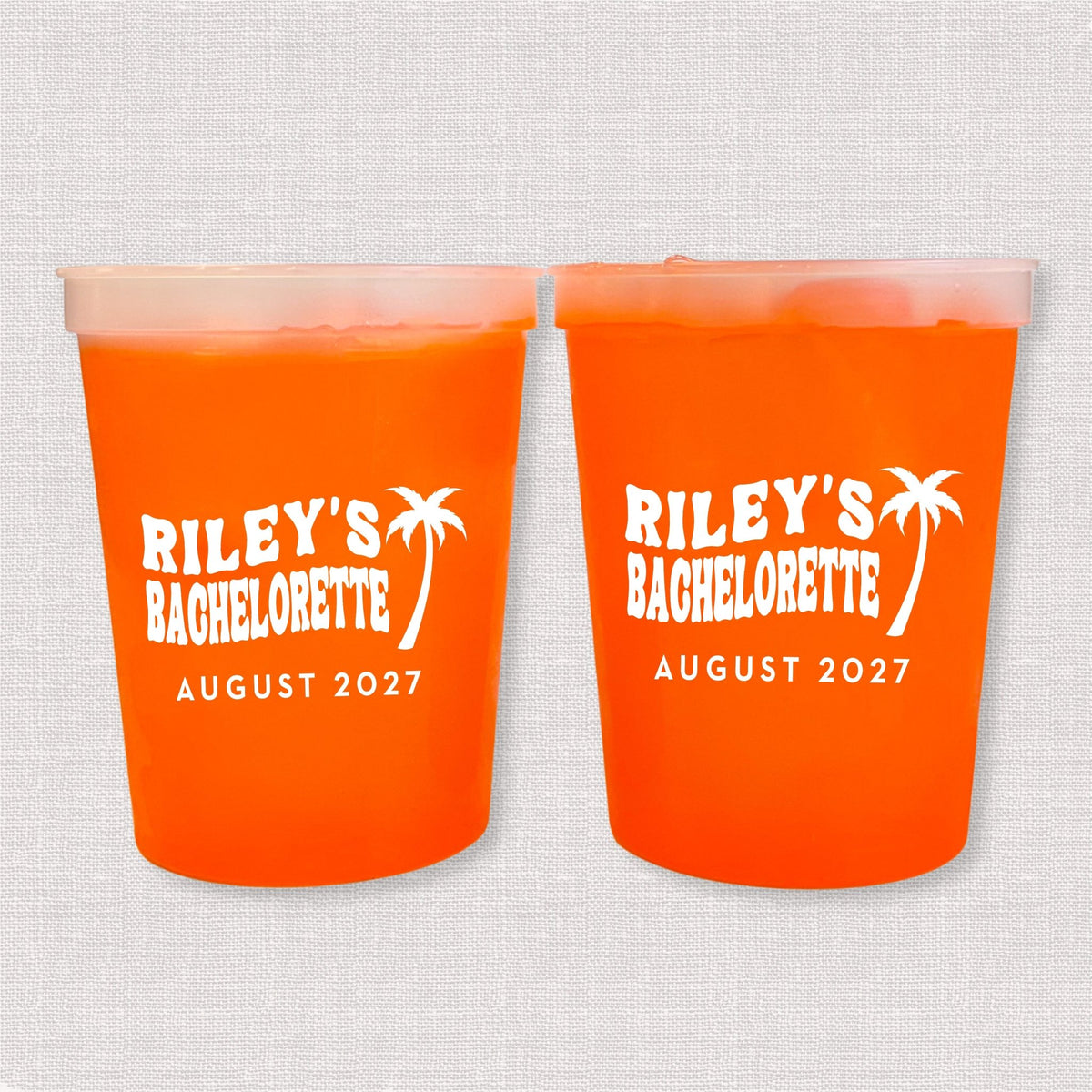 Orange color changing bachelorette stadium cups with palm tree and Riley's Bachelorette August 2027