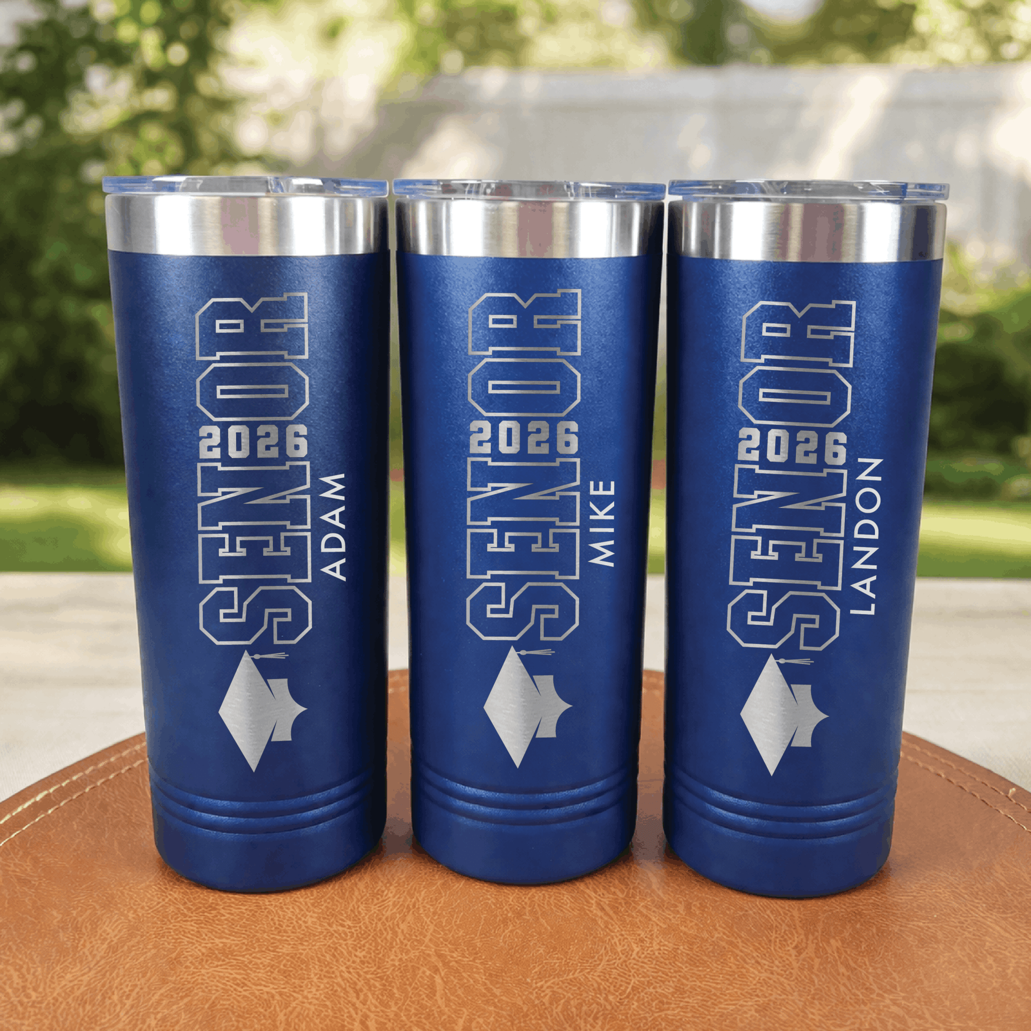 Navy blue skinny tumbler with silver senior class design and personalized text