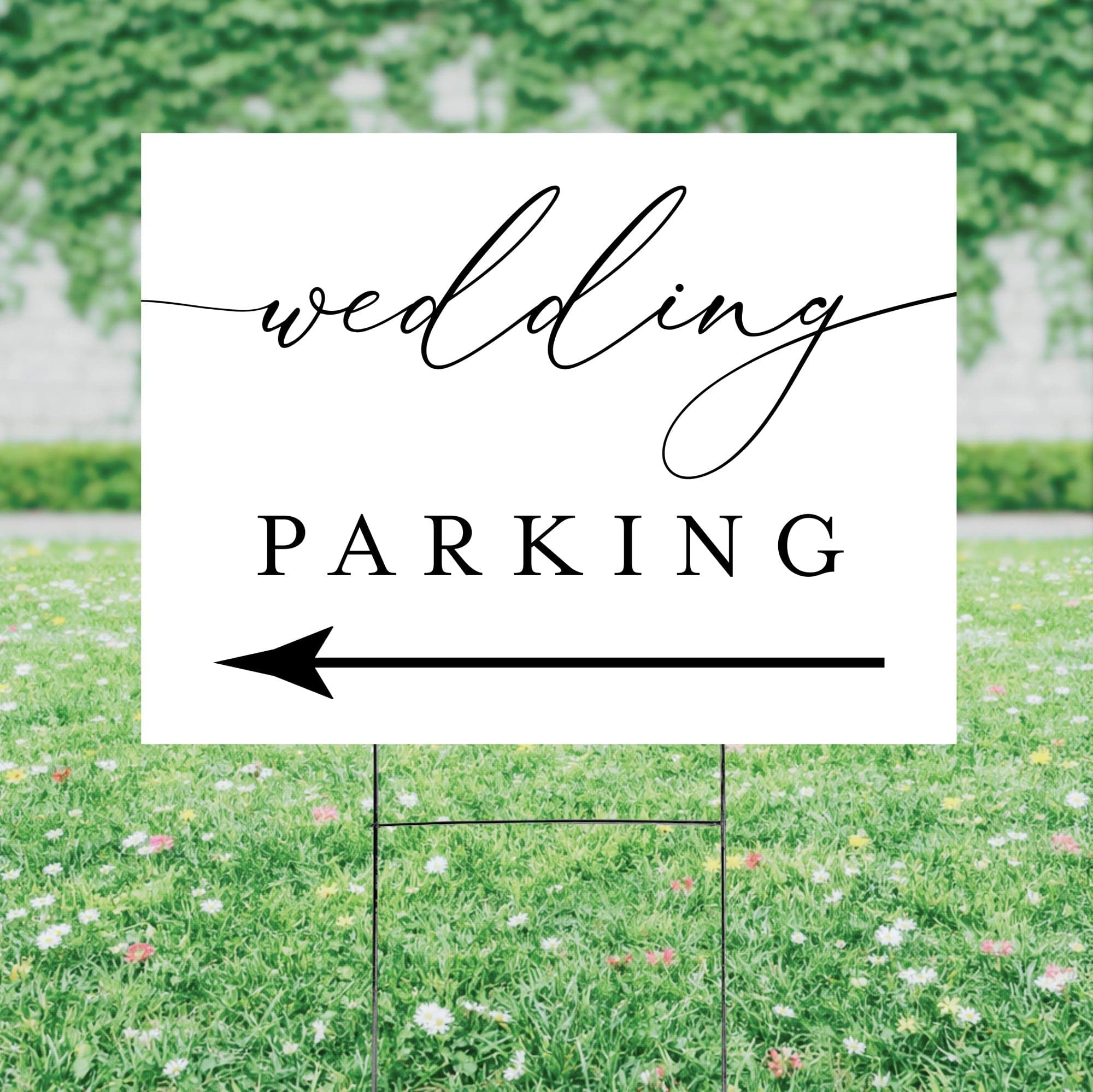 A white corrugated plastic wedding yard sign on a metal H-stake, featuring black text and an arrow to direct guests to parking.