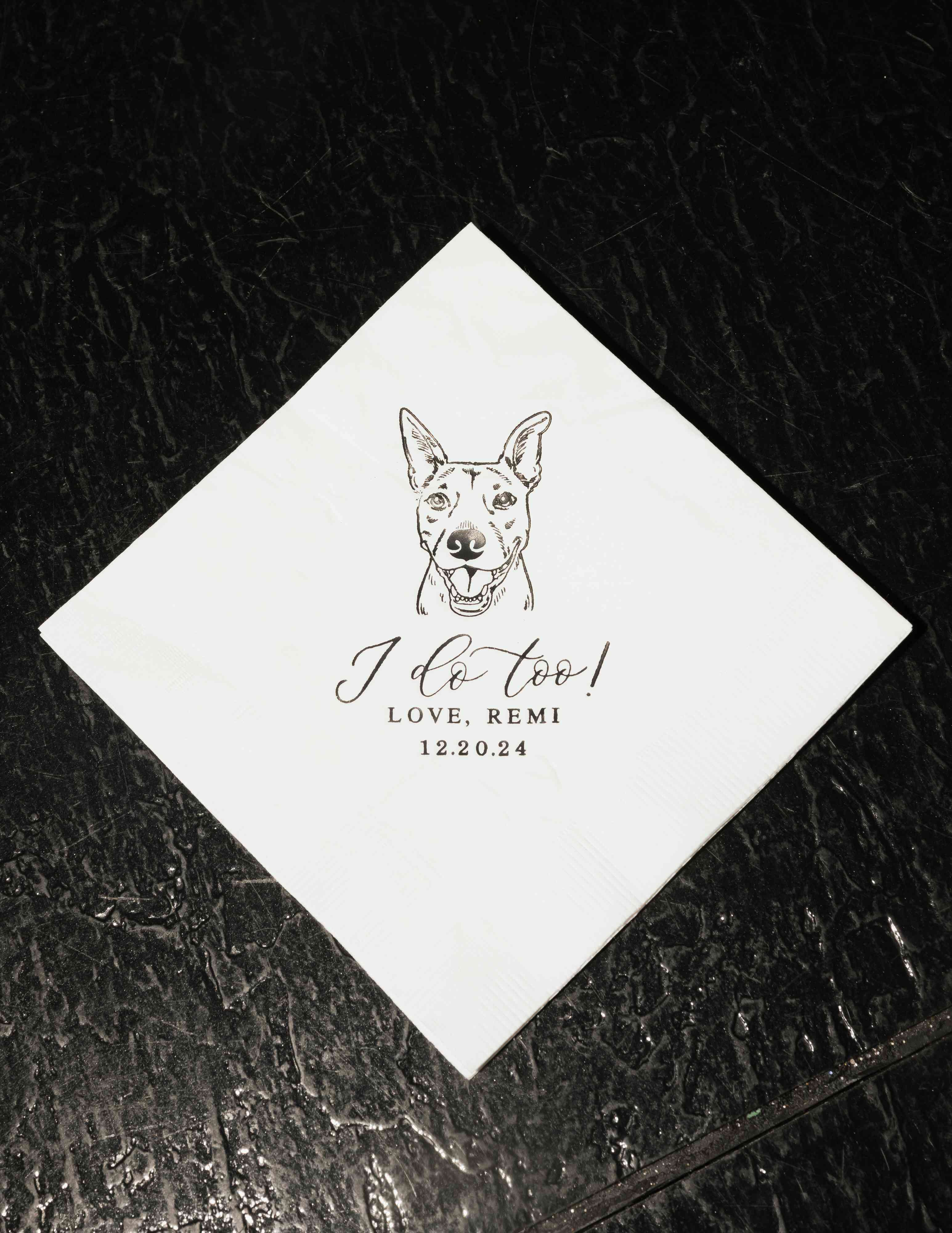 White custom paper napkins featuring a delightful pet illustration, ideal for elegant wedding reception decor.