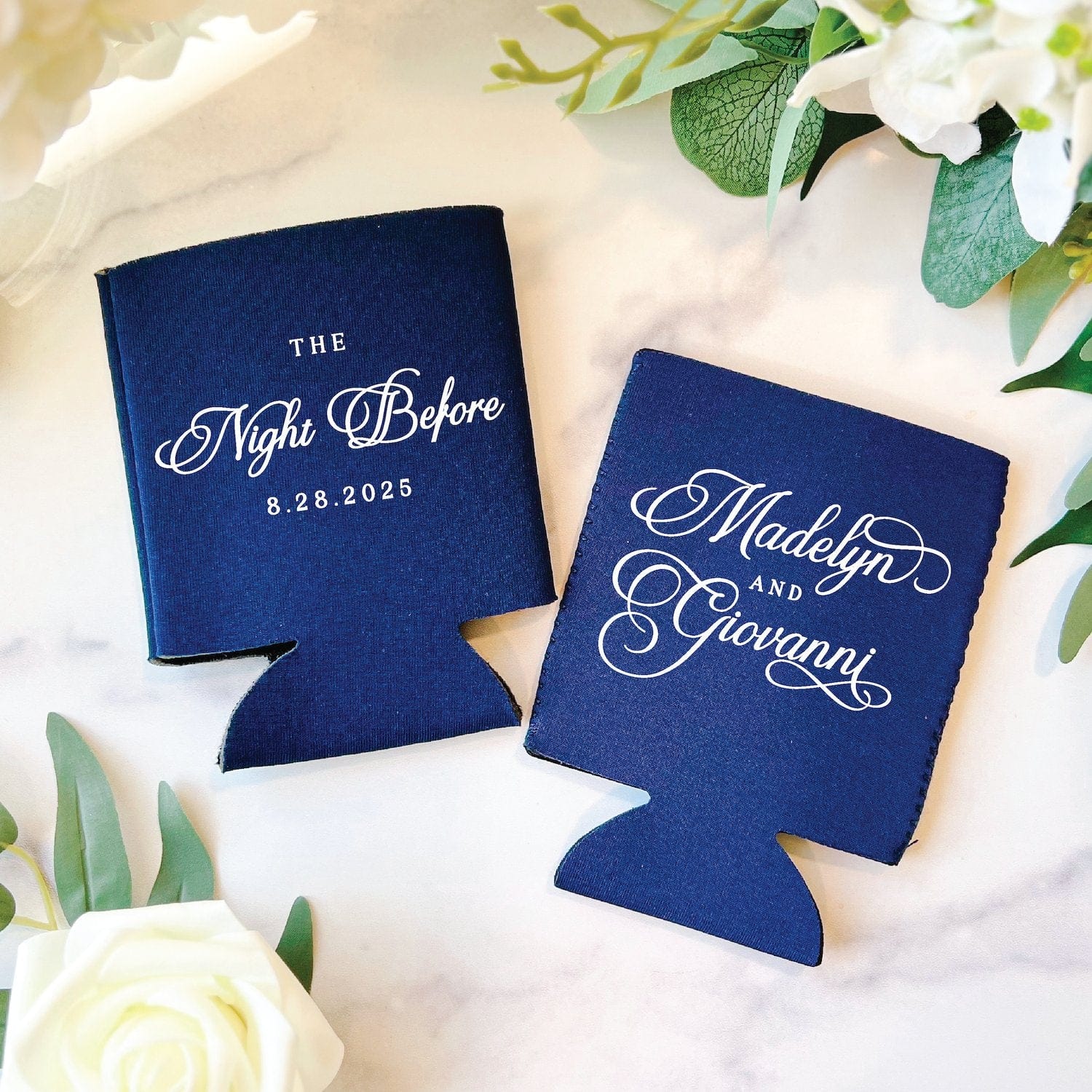 Two personalized navy blue neoprene can coolers featuring elegant white script, suitable for a wedding or rehearsal dinner event.