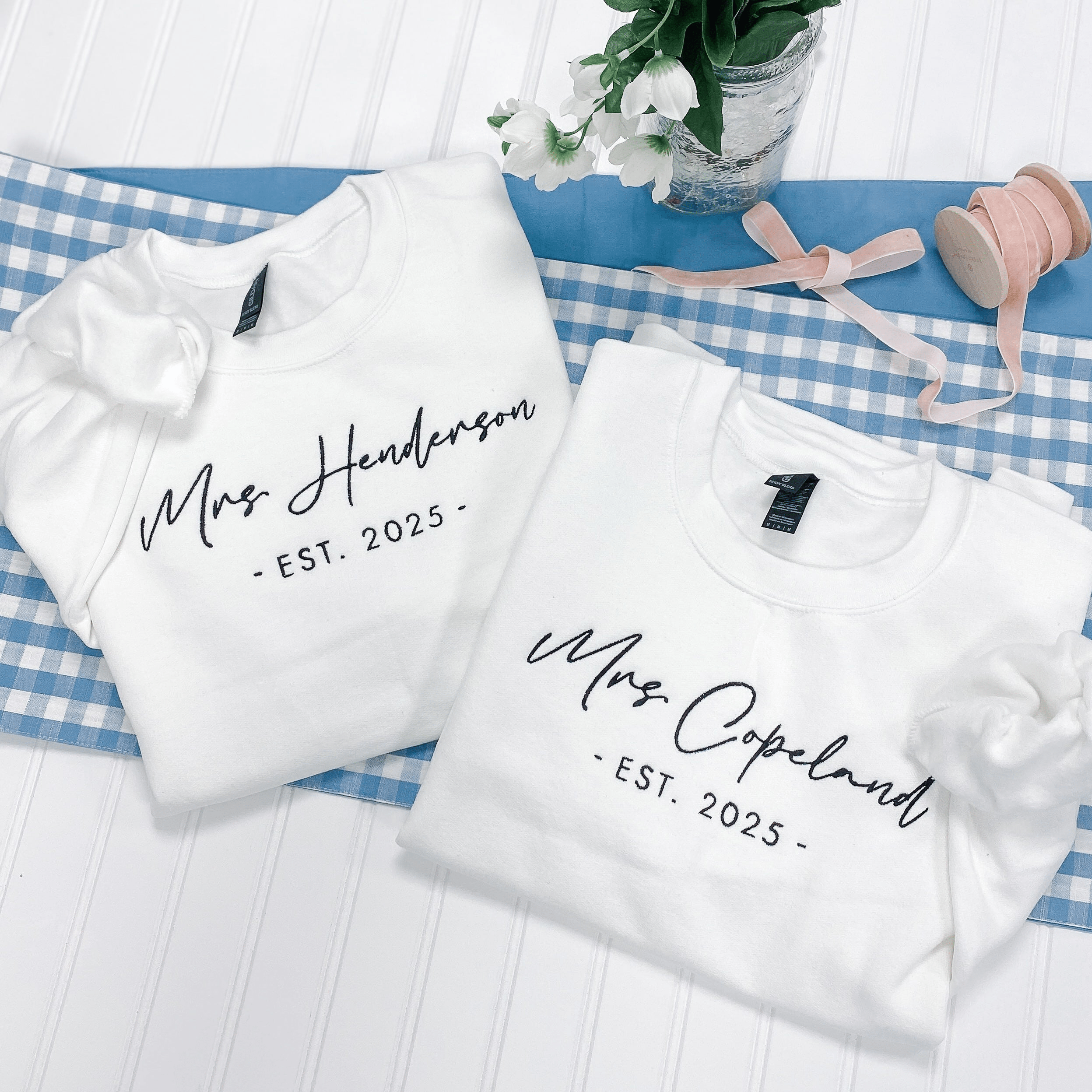 Flatlay of personalized bride gifts sweatshirts