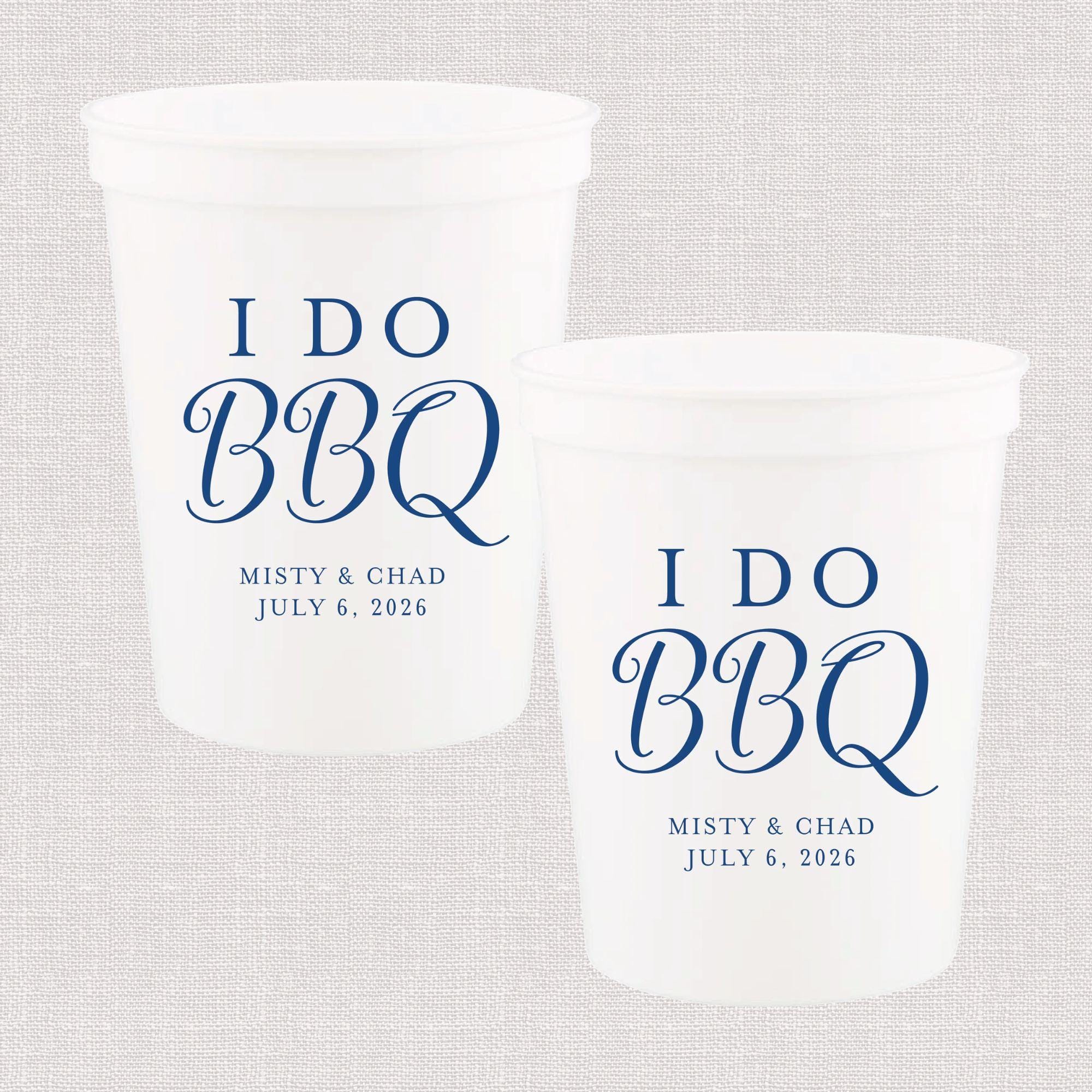 Two white frosted stadium cups printed with "I Do BBQ" in blue script, personalized with names and wedding date July 6, 2026.