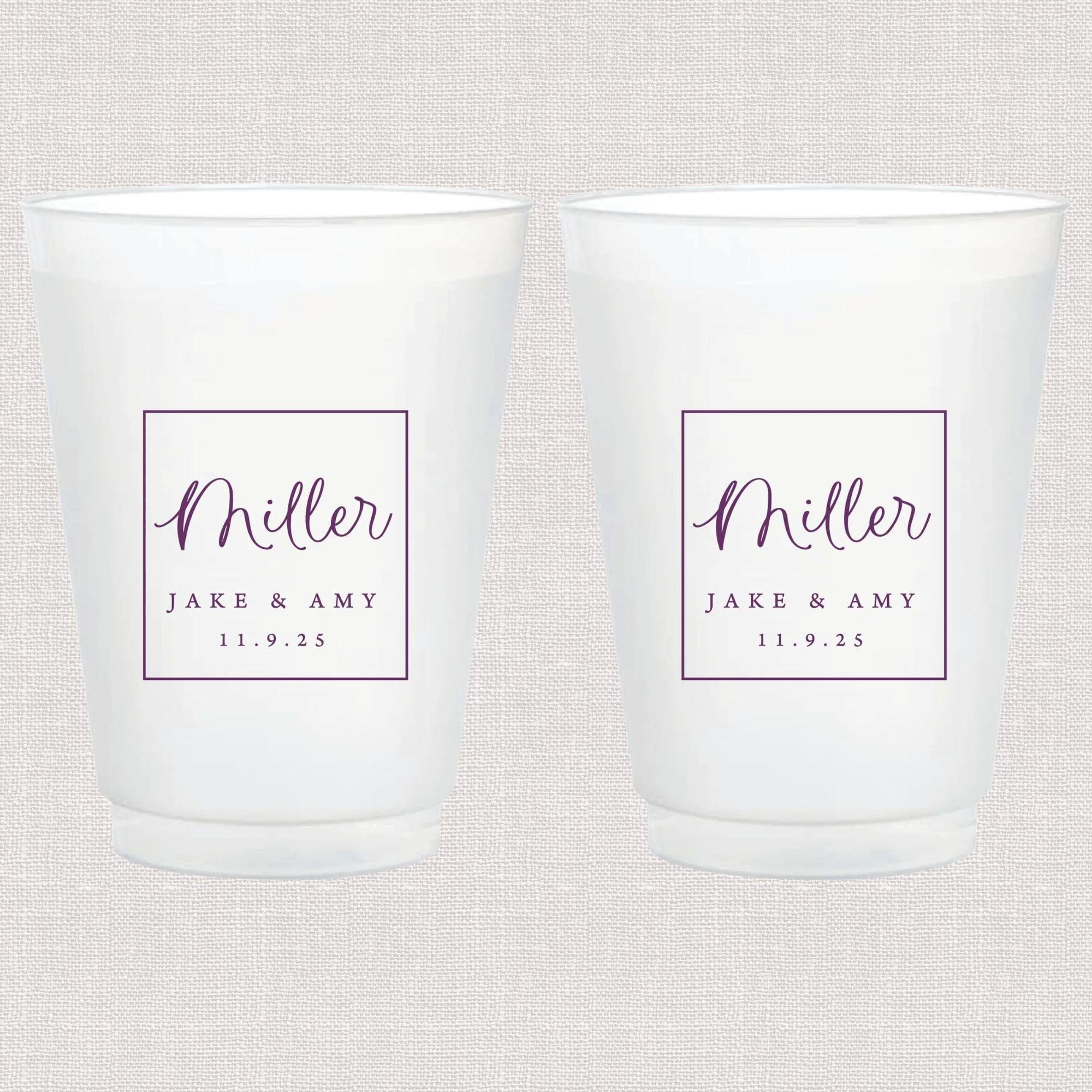 Pair of frosted white cups with purple script text reading "Miller" and "Barr & Amy 11.9.23" in framed boxes