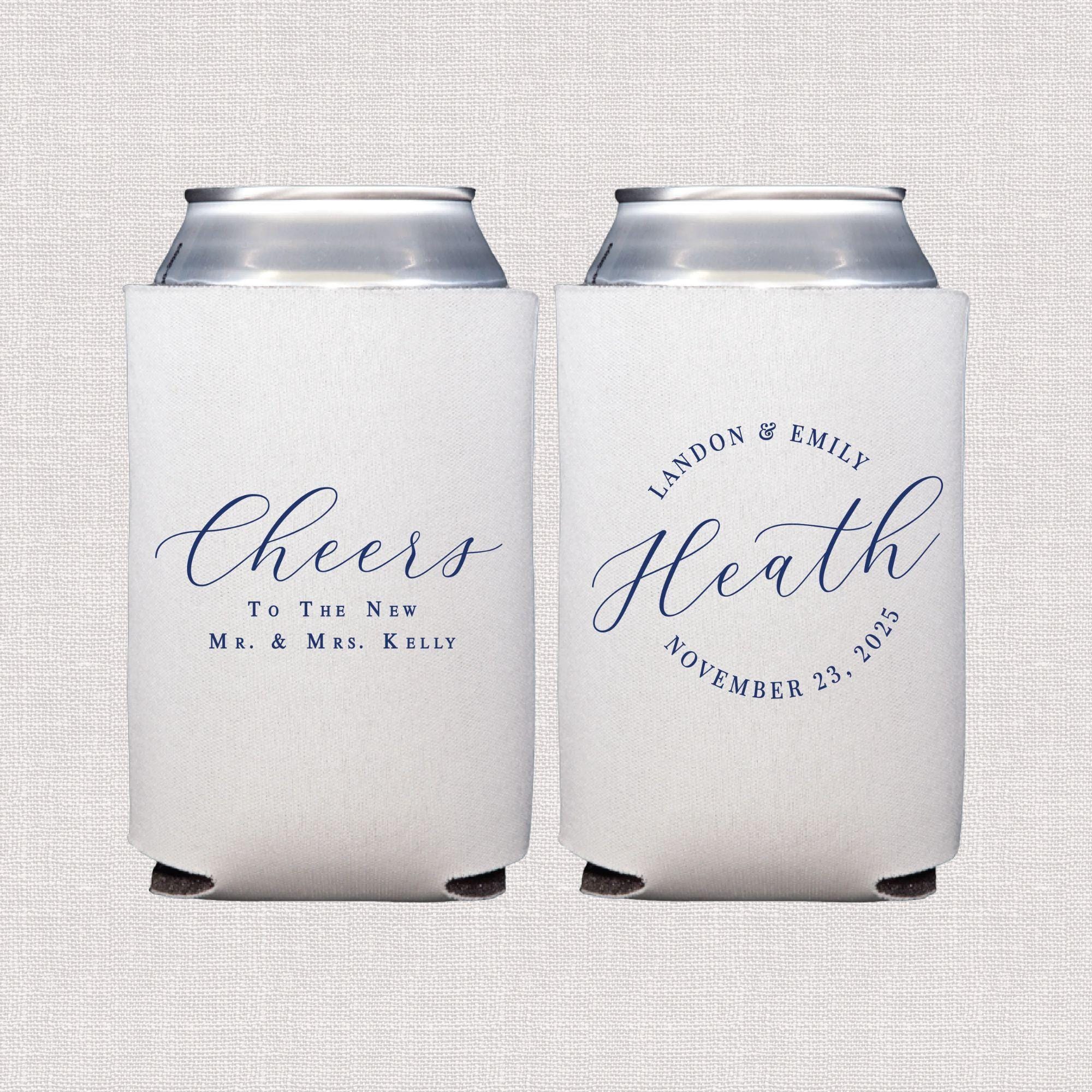 White can coolers with navy script text reading "Cheers To The New M.r & Mrs. Kelly" and "Landon & Emily Heath November 23 2024"