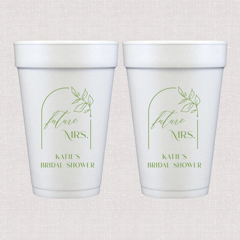 White foam cup with sage green floral arch and personalized wedding text design