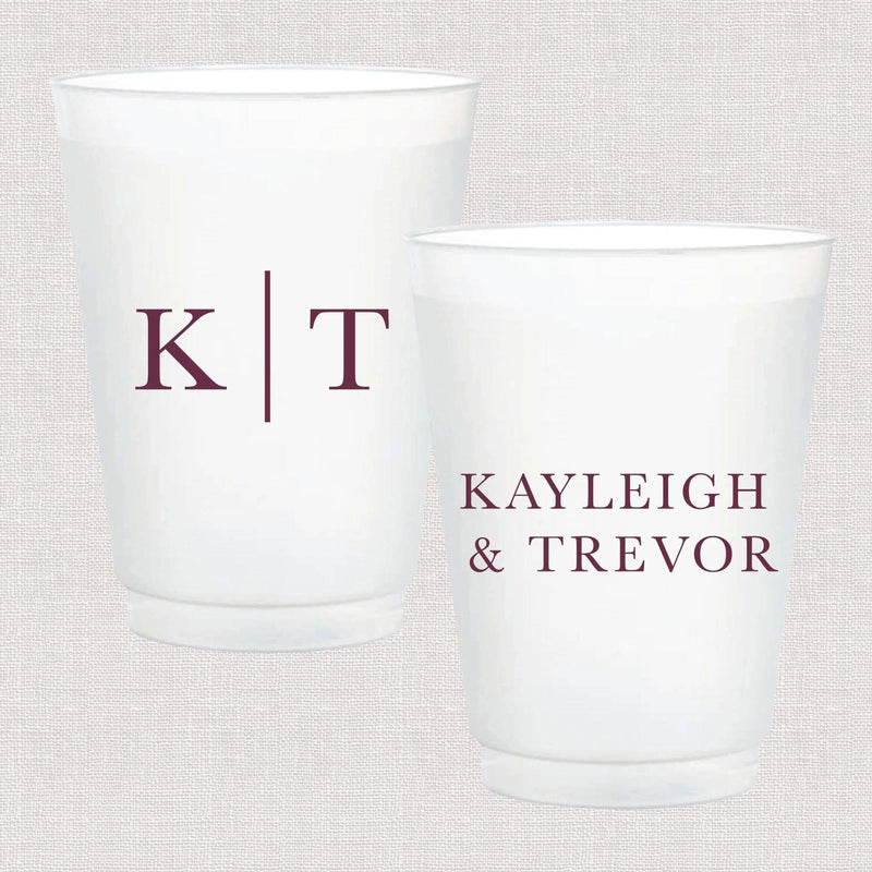 Two frosted white cups with burgundy text: one showing initials "K T" and the other displaying "KAYLEIGH & TREVOR"