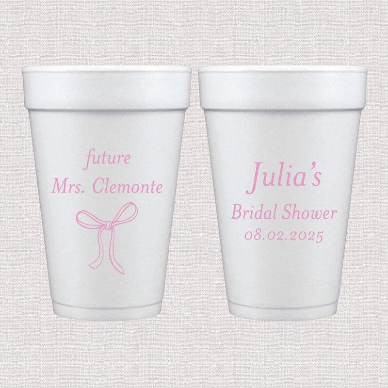 White foam cups with pink bow design and personalized bridal shower text
