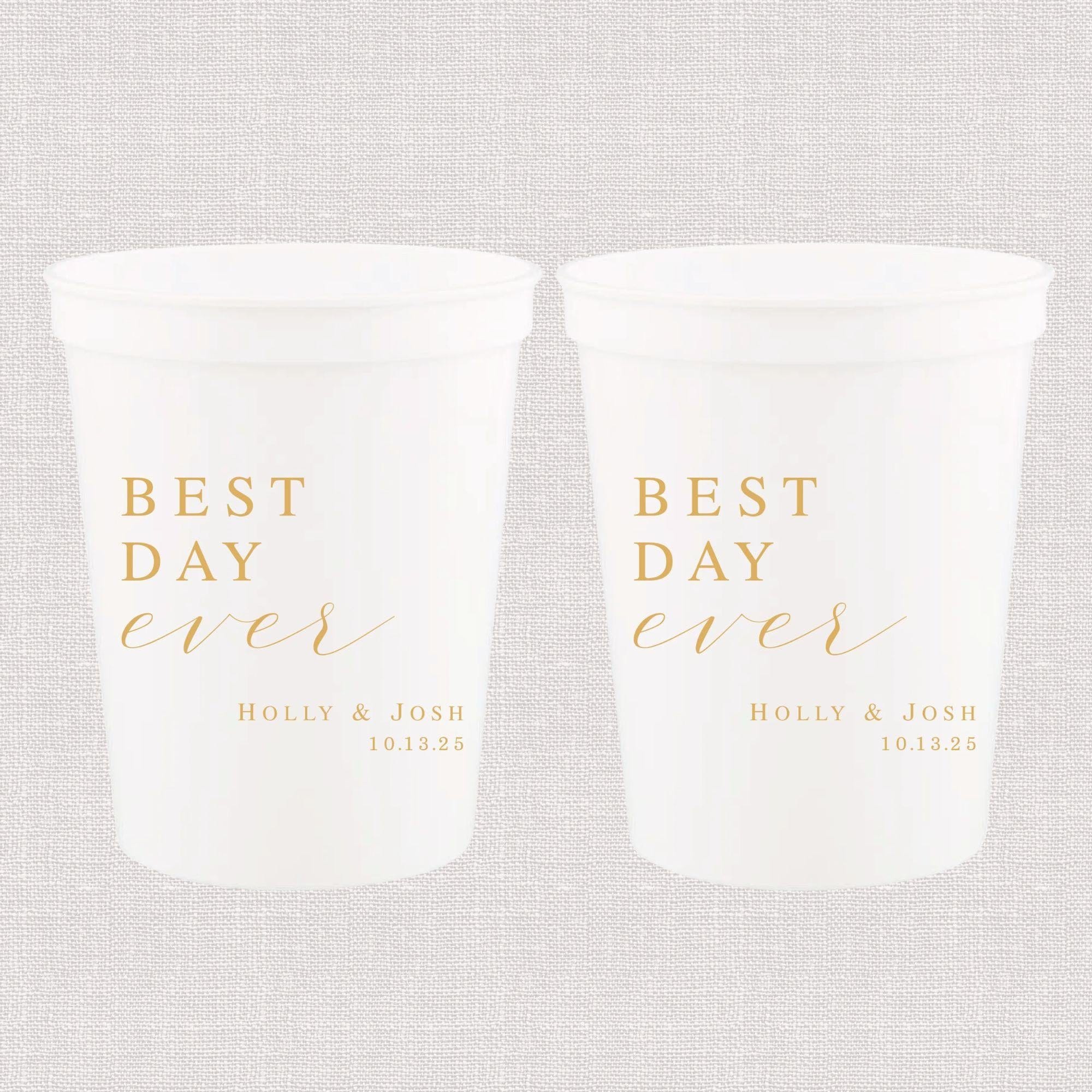 Two frosted stadium cups with gold "Best Day Ever" text and personalized names Holly & Josh with wedding date 10.12.25