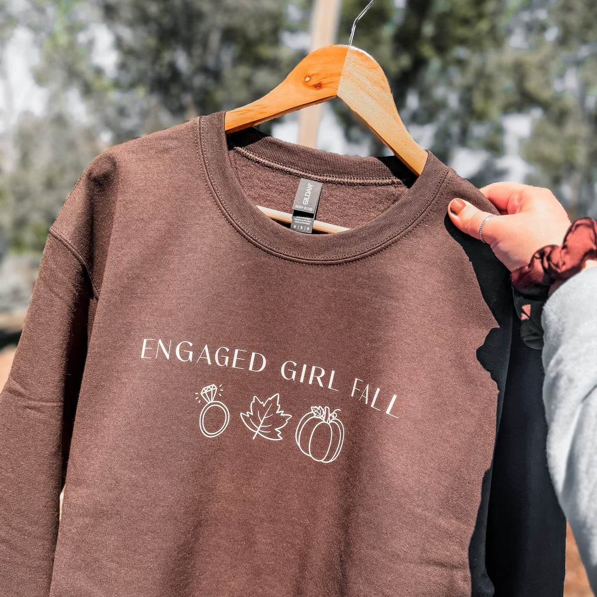 Brown Engaged Girl Fall crewneck sweatshirt on a wooden hanger, cozy fall bride to be sweatshirt
