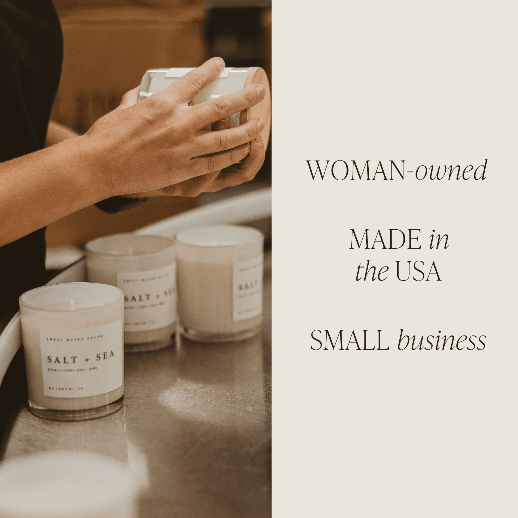 Hands holding white soy candle jar with "SALT + AIR" label, displayed with matching candles on white surface