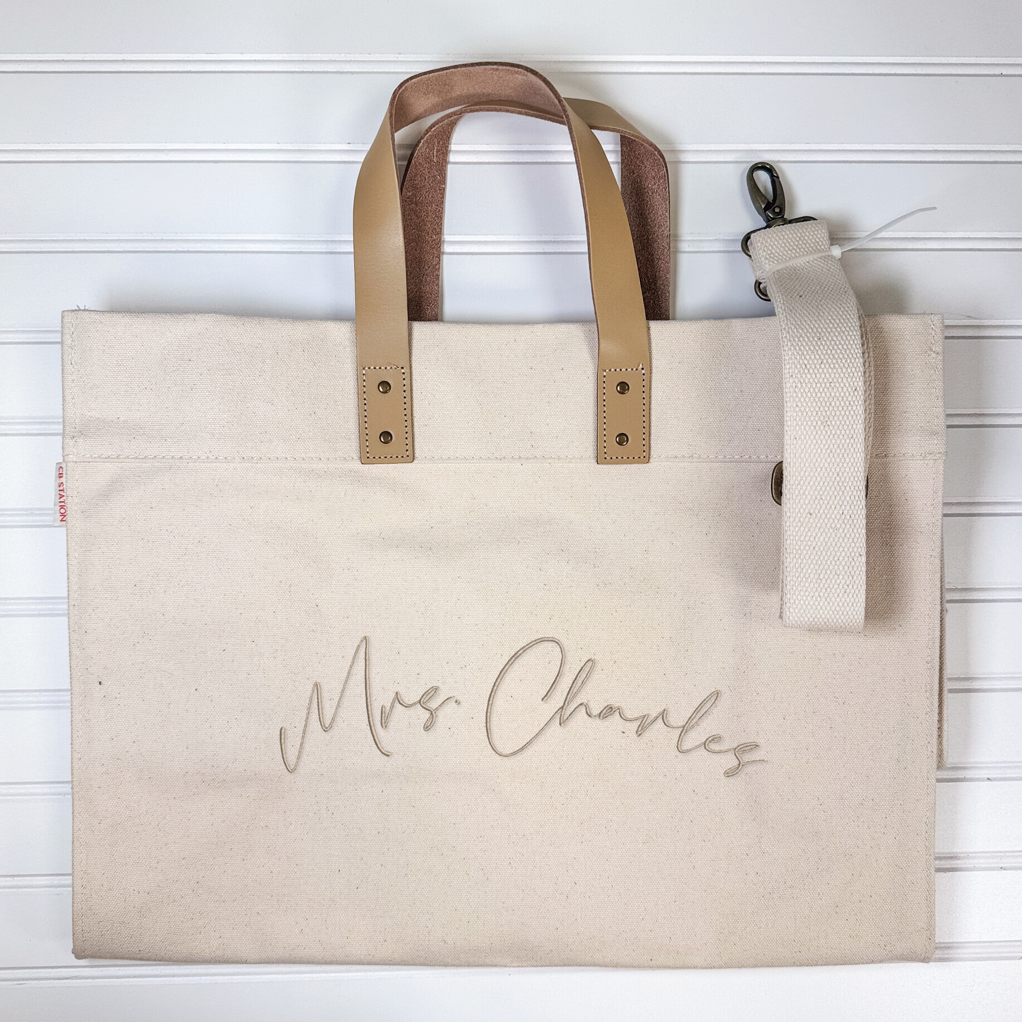 Monogrammed canvas tote with genuine leather handles