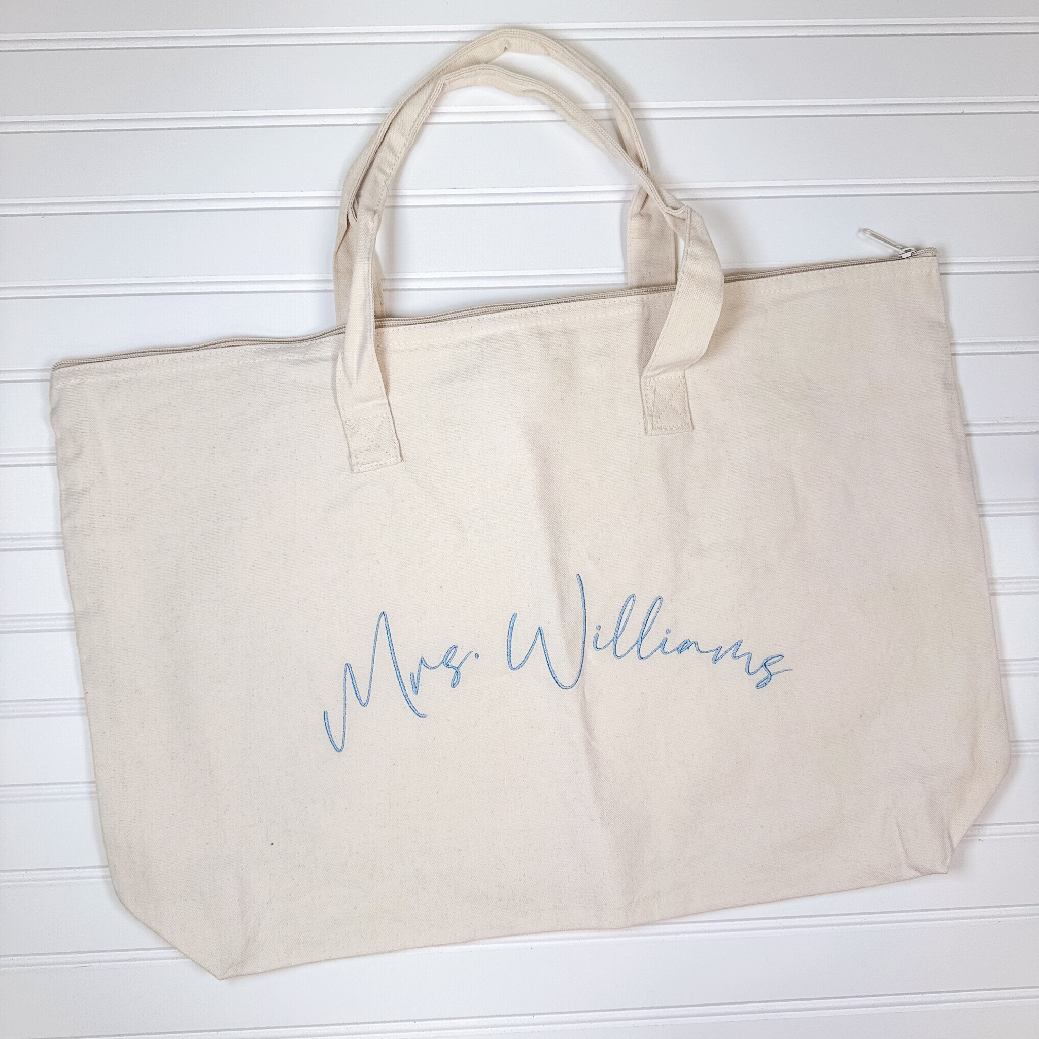 Personalized zippered canvas tote bag with Mrs. last name embroidery