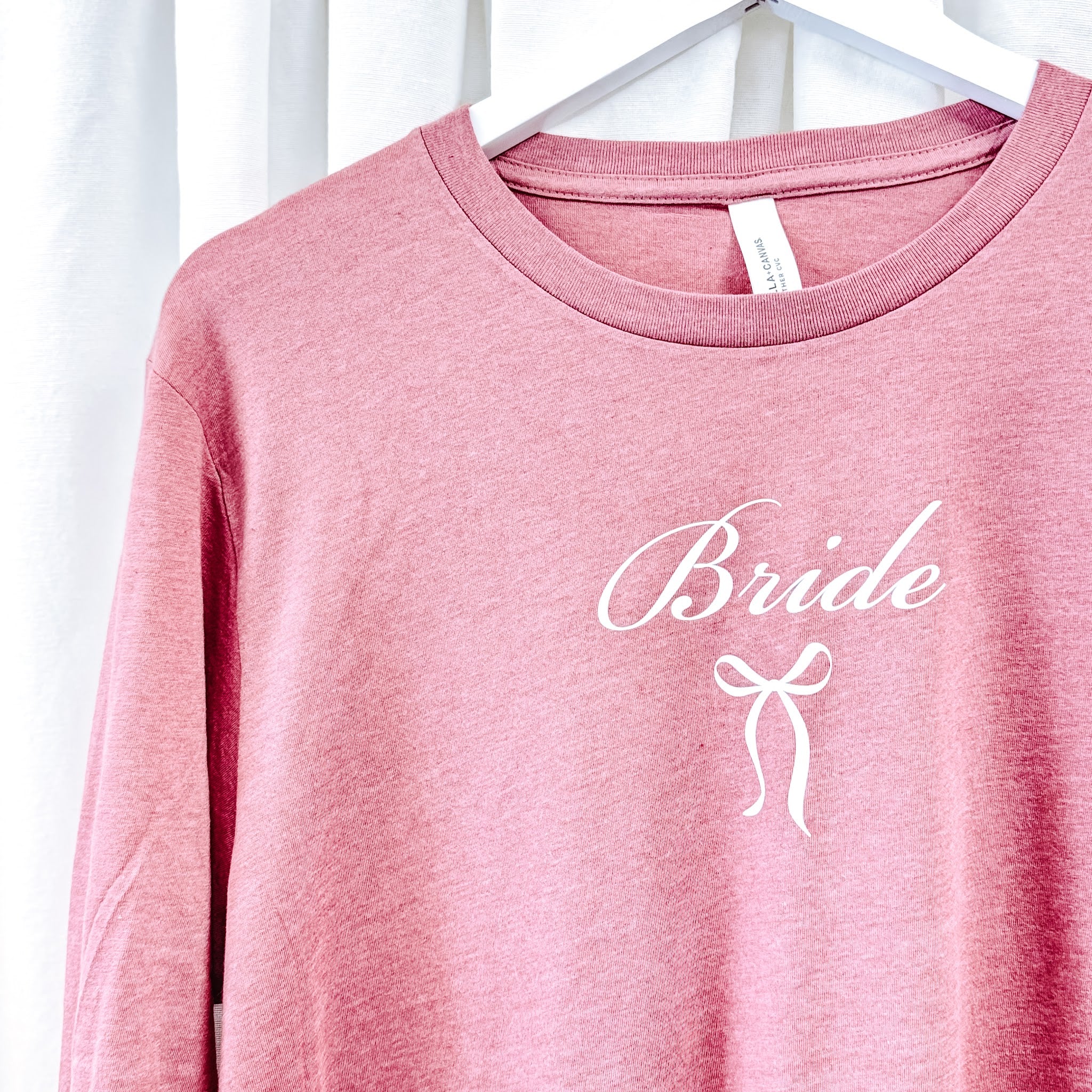 Close-up of Bride script and bow design on mauve long sleeve tee