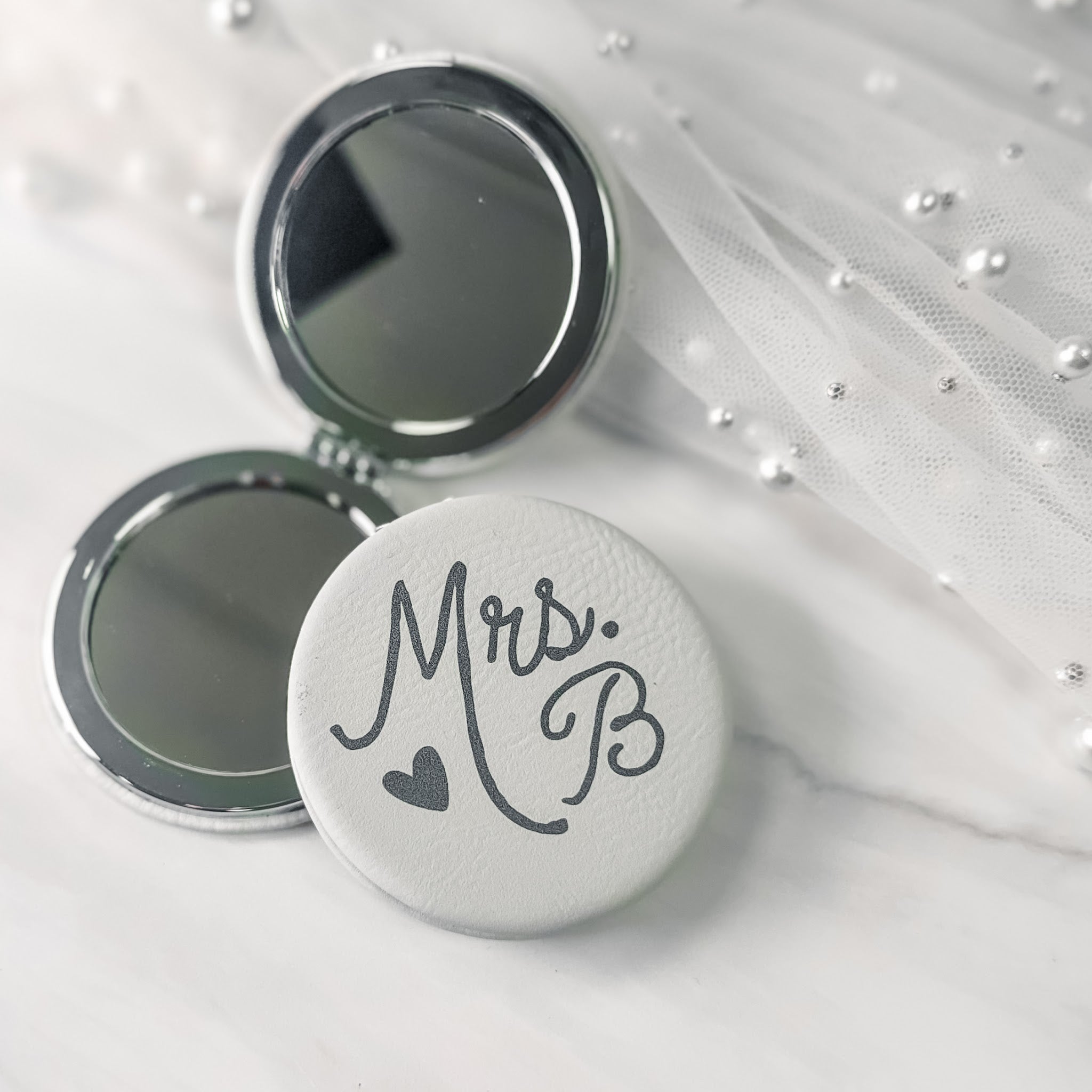 Personalized white leatherette compact mirror UV-printed with Mrs. and last initial