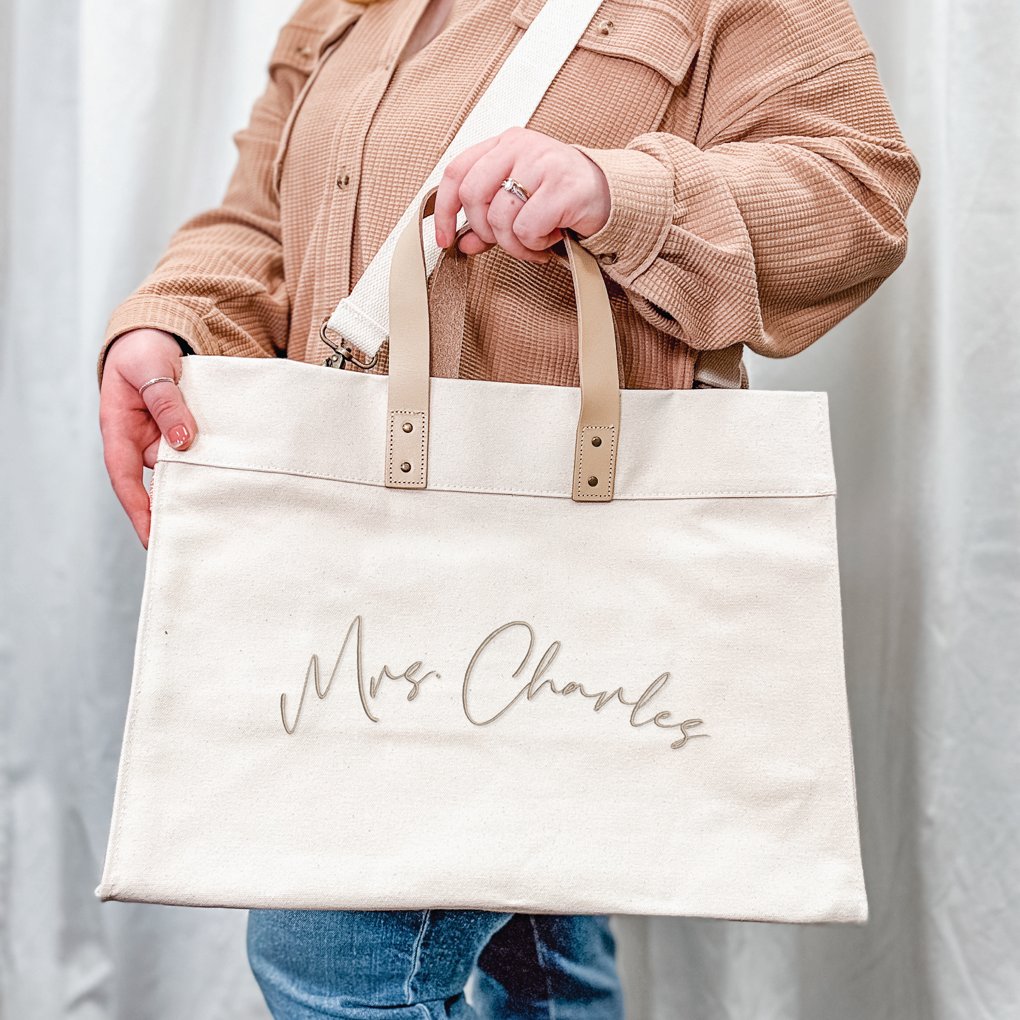 Personalized canvas tote showing interior side pockets