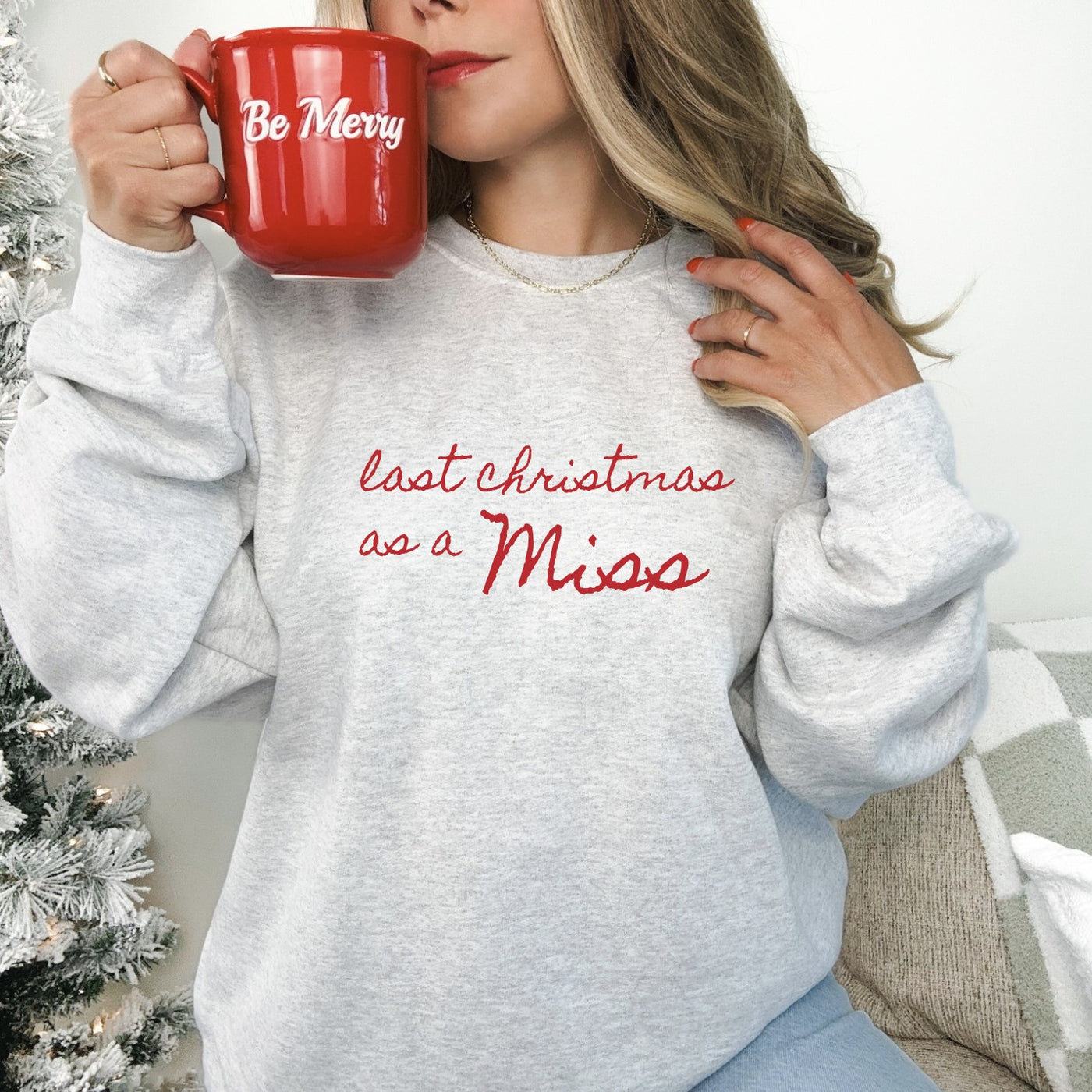 A light grey long-sleeved sweatshirt with a custom red script design, perfect for celebrating a special pre-wedding milestone during the holiday season.