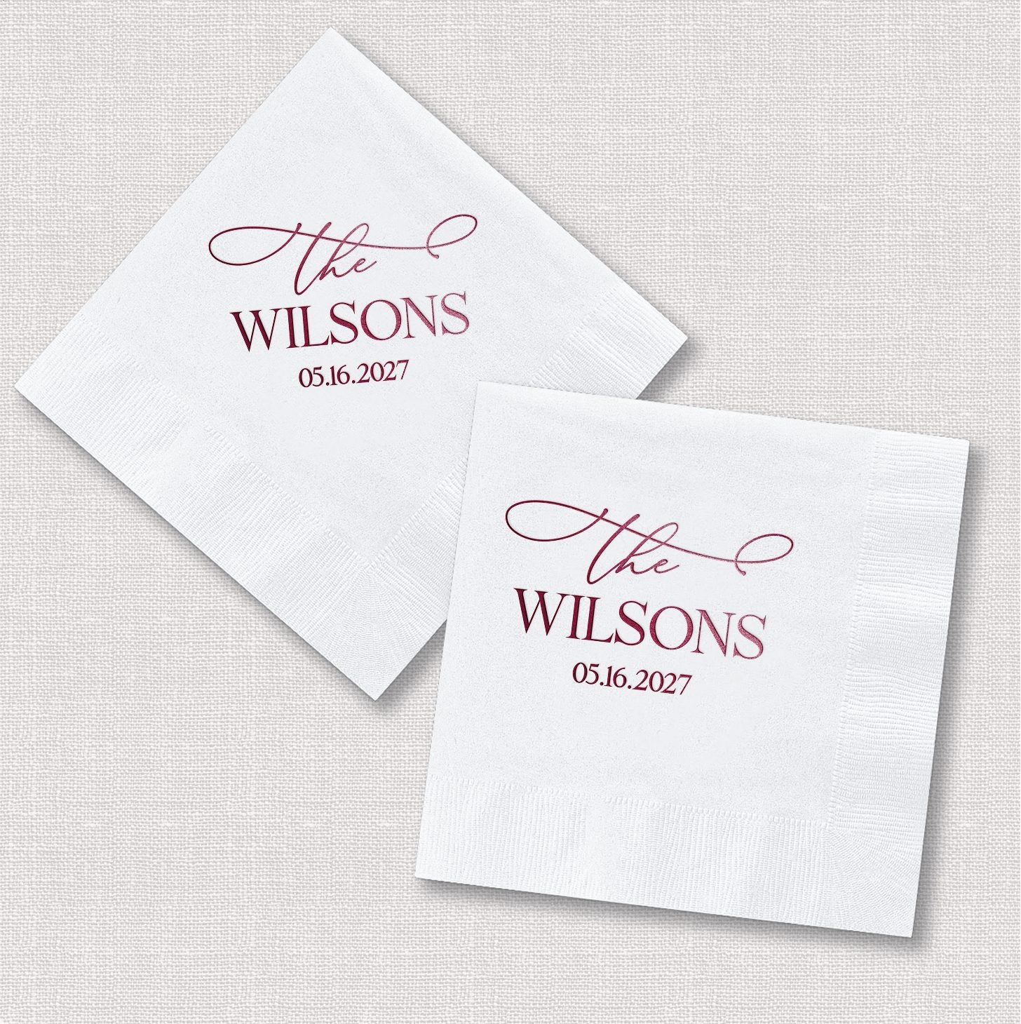 Personalized Elegant Last Name napkins shown in square and diamond orientation with bold serif and script typography in berry wine tones