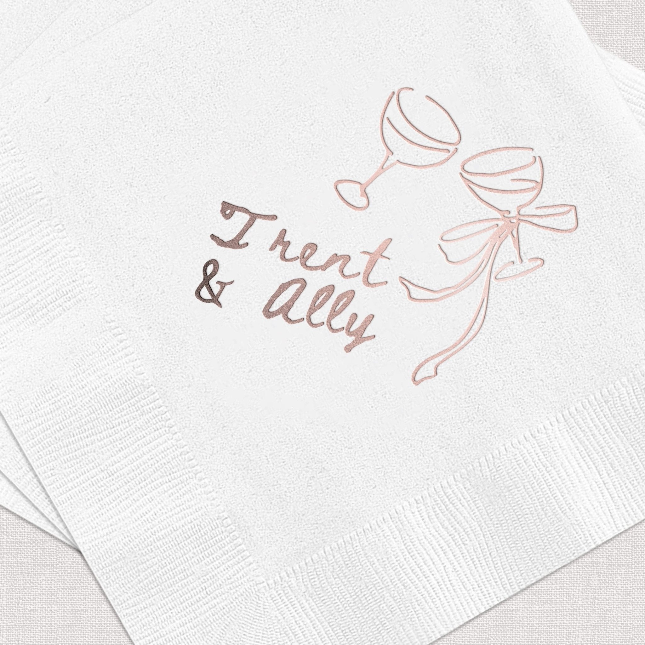White napkin with champagne glasses and "Treat & ally" personalized text in rose gold foil stamping