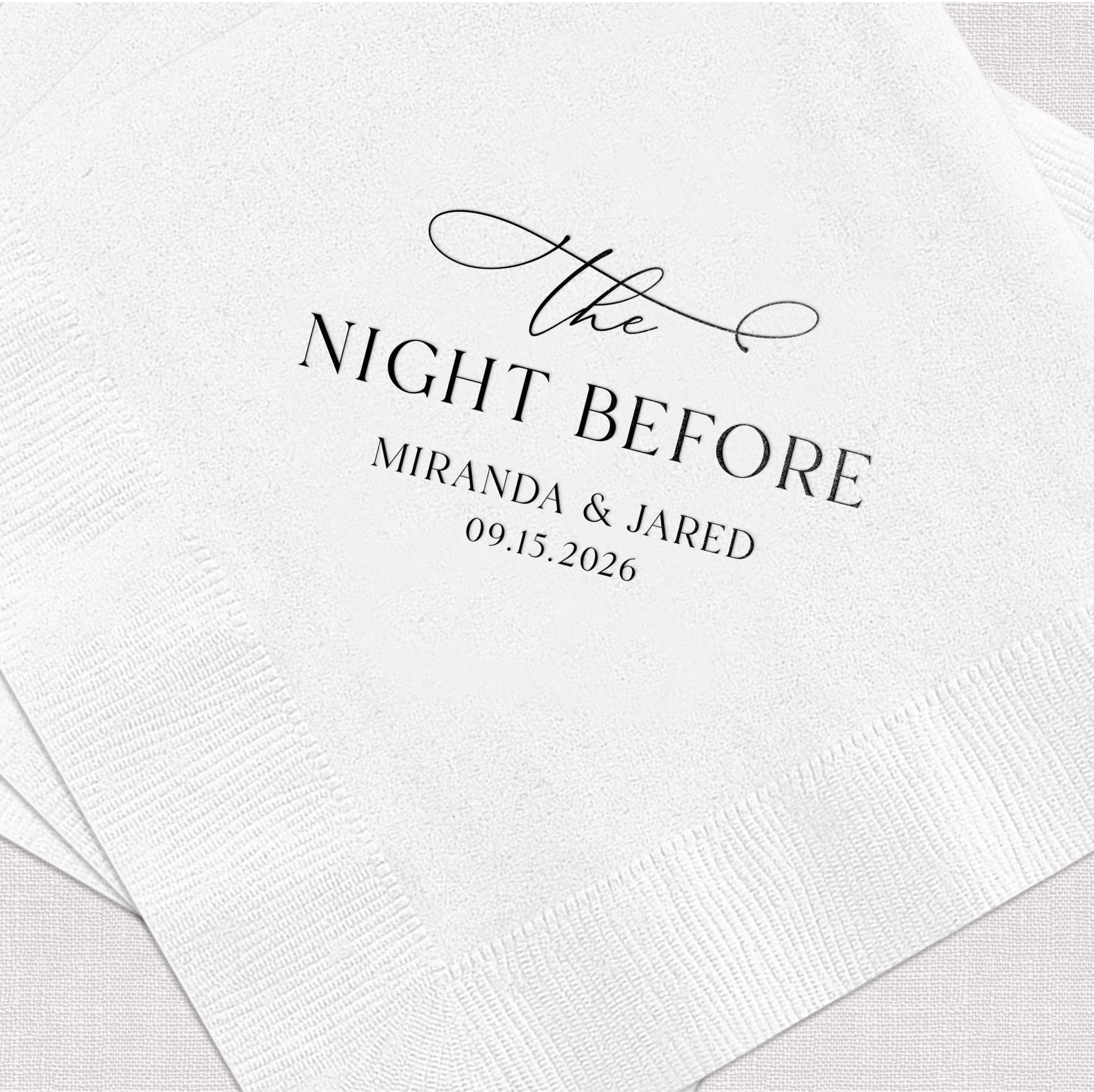 White cocktail napkins with "the Night Before" in script and couples names Miranda & Jared with wedding date 09.15.2026 in elegant foil stamped text.