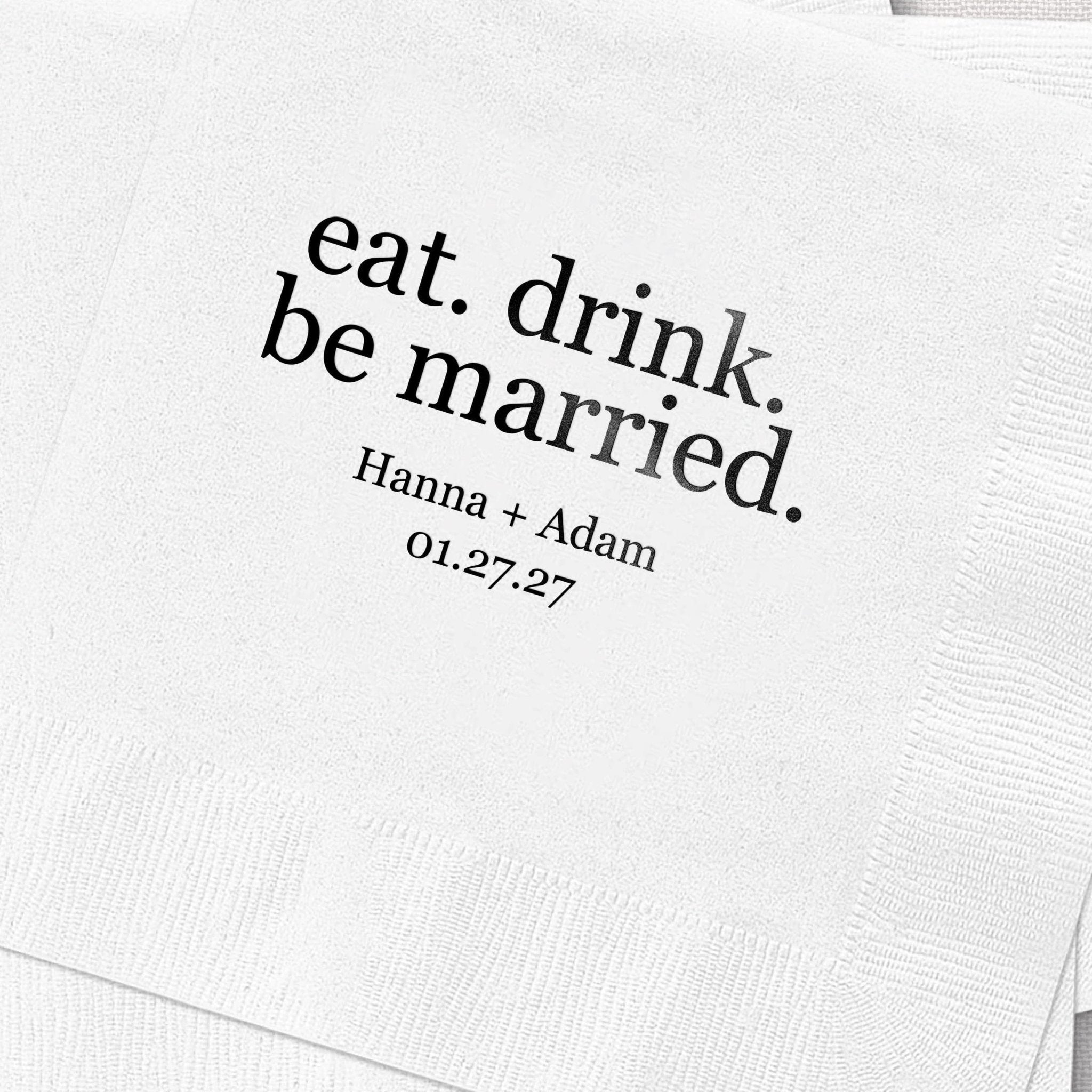 White napkin with black text reading "eat. drink. be married." and personalized names "Hanna + Adam" with date "01.27.27"