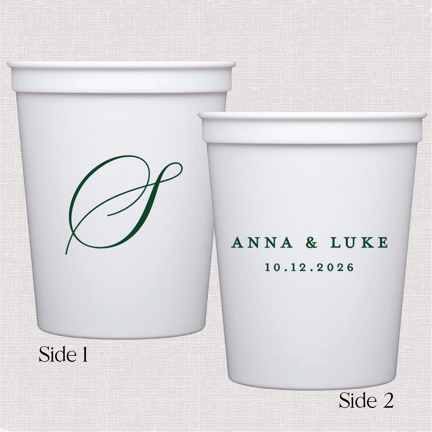 White paper cups showing both sides: elegant monogram initial on front, couple names and wedding date on back.