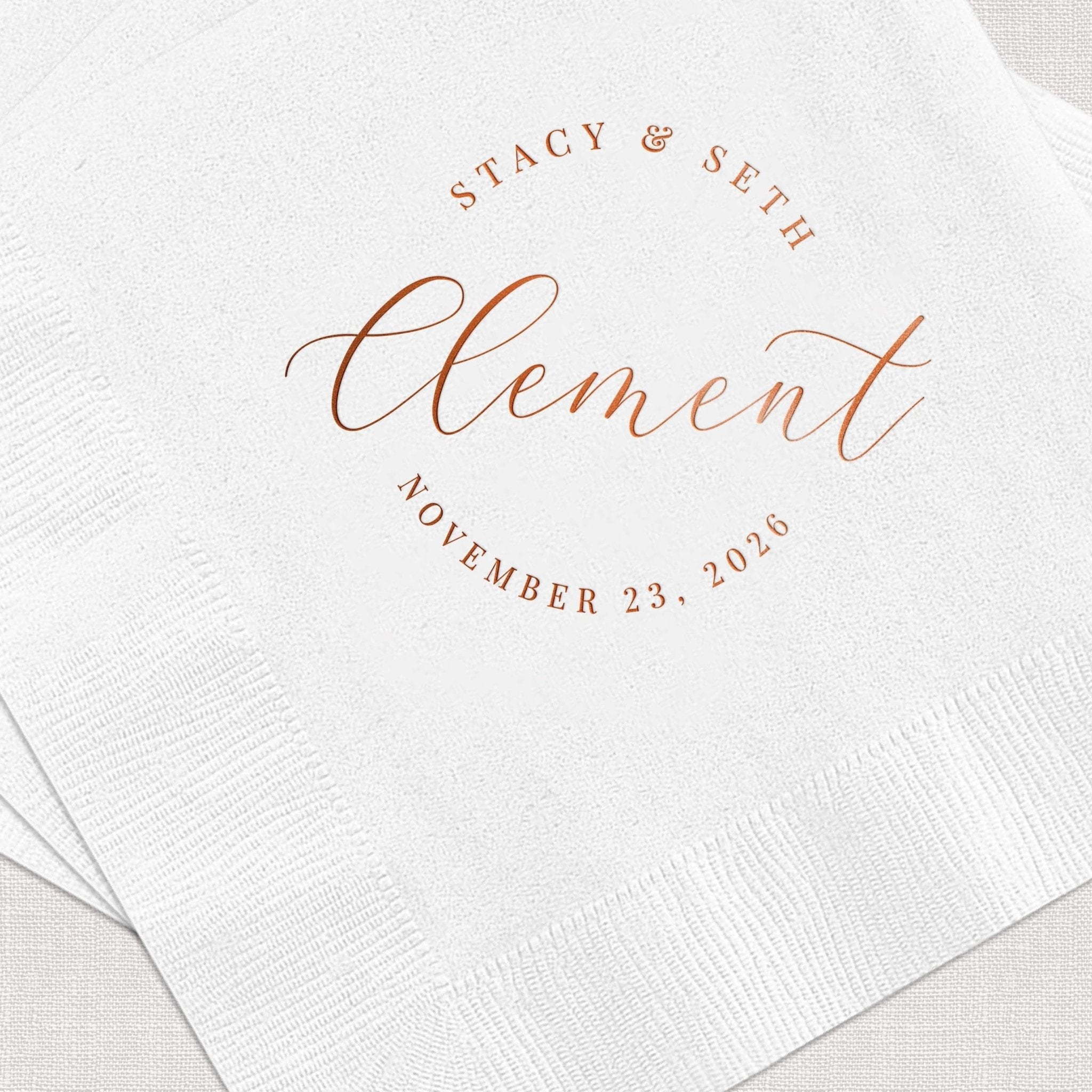 White napkin with rose gold foil stamped text reading "Stacy & Seth" and "element" with wedding date November 23, 2020